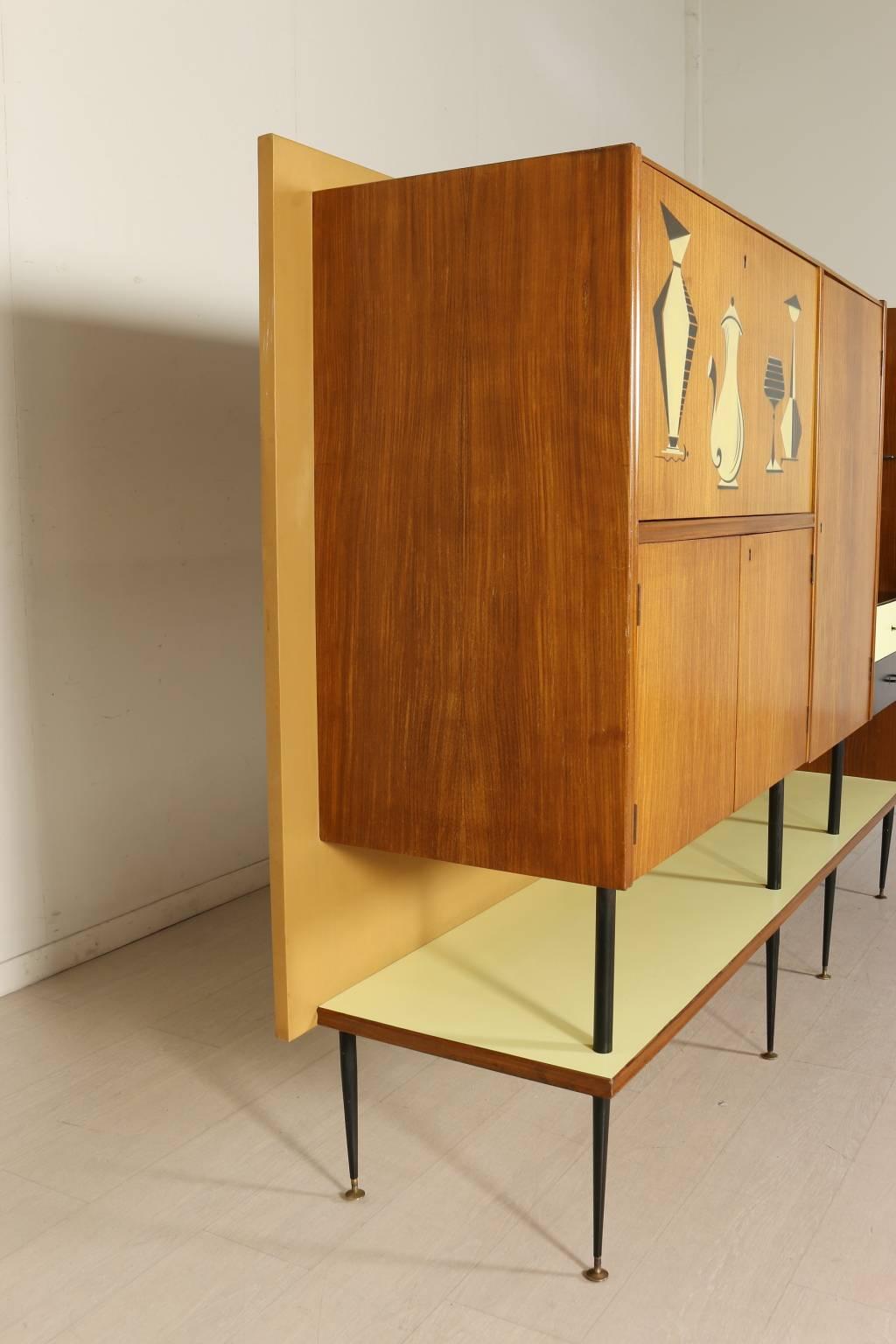 A living room cabinet, mahogany veneer covered with Formica, metal. Manufactured in Italy, 1950s.