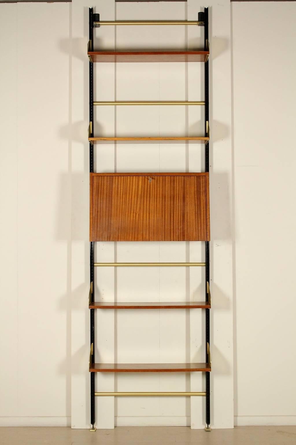 'Feal' wall bookcase with elements adjustable in height and drop-leaf desk, mahogany veneer, metal uprights, brass. Manufactured in Italy, 1950s.