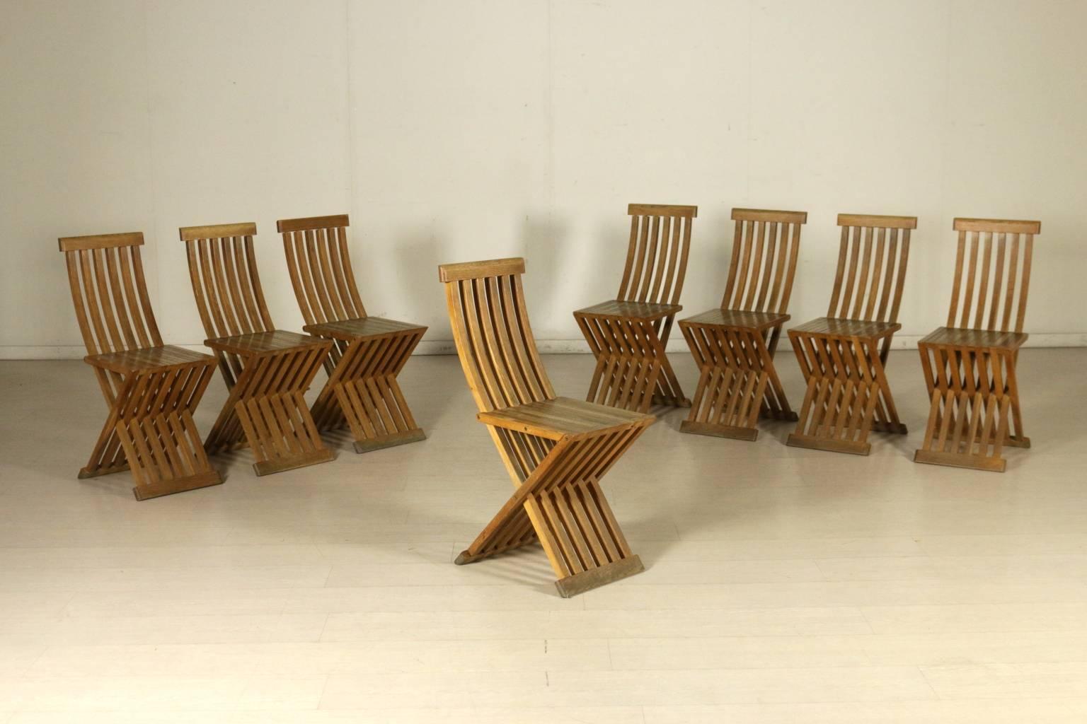 A group of eight natural oak folding chairs designed by Studio Simon for Cassina. The model Tomasa is inspired by the chair designed by Paolo Uccello, with a change in the curves and a reduction of the number of wooden elements. Manufactured in