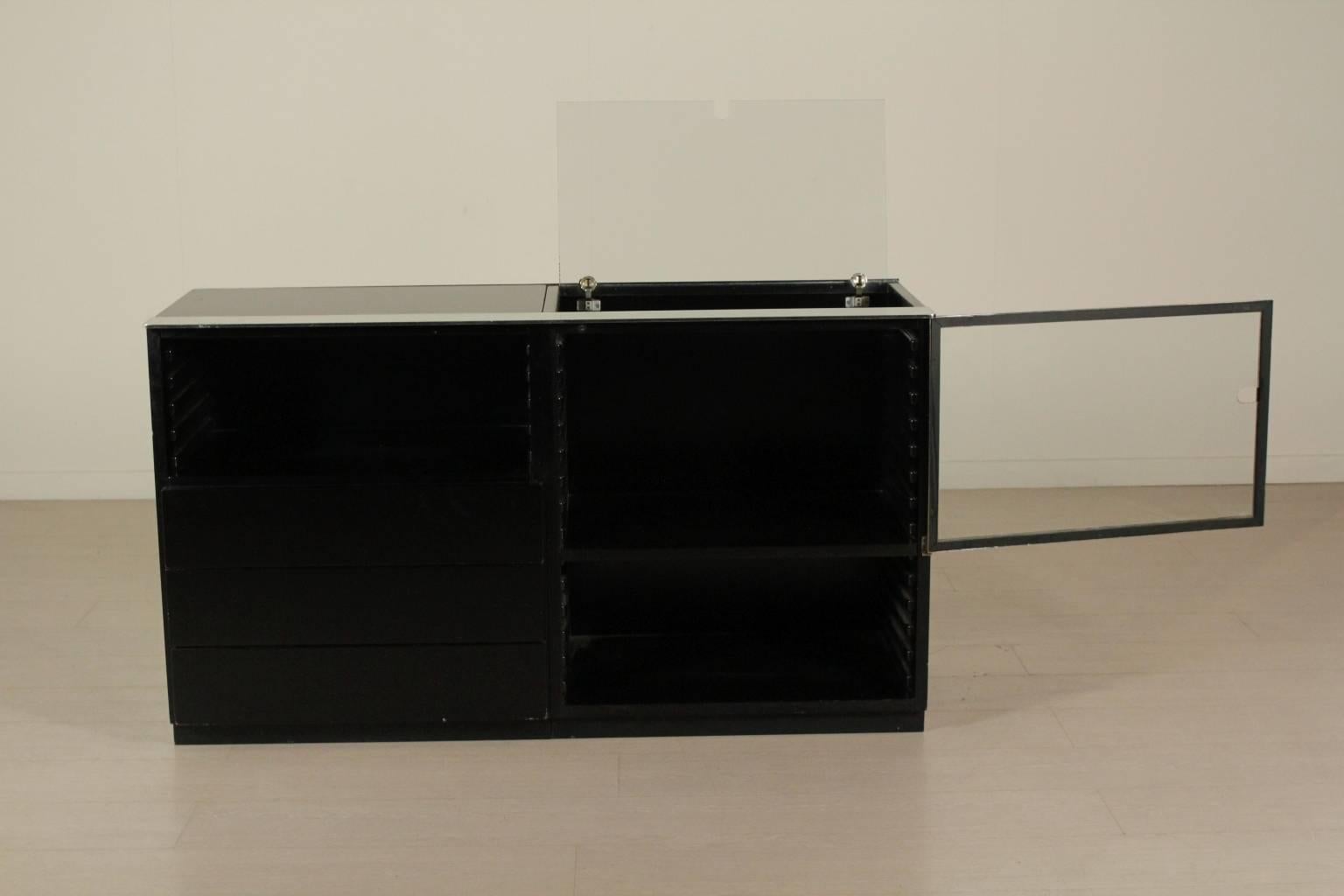 A cabinet, lacquered wood, metal, glass. Manufactured in Italy, 1970s.