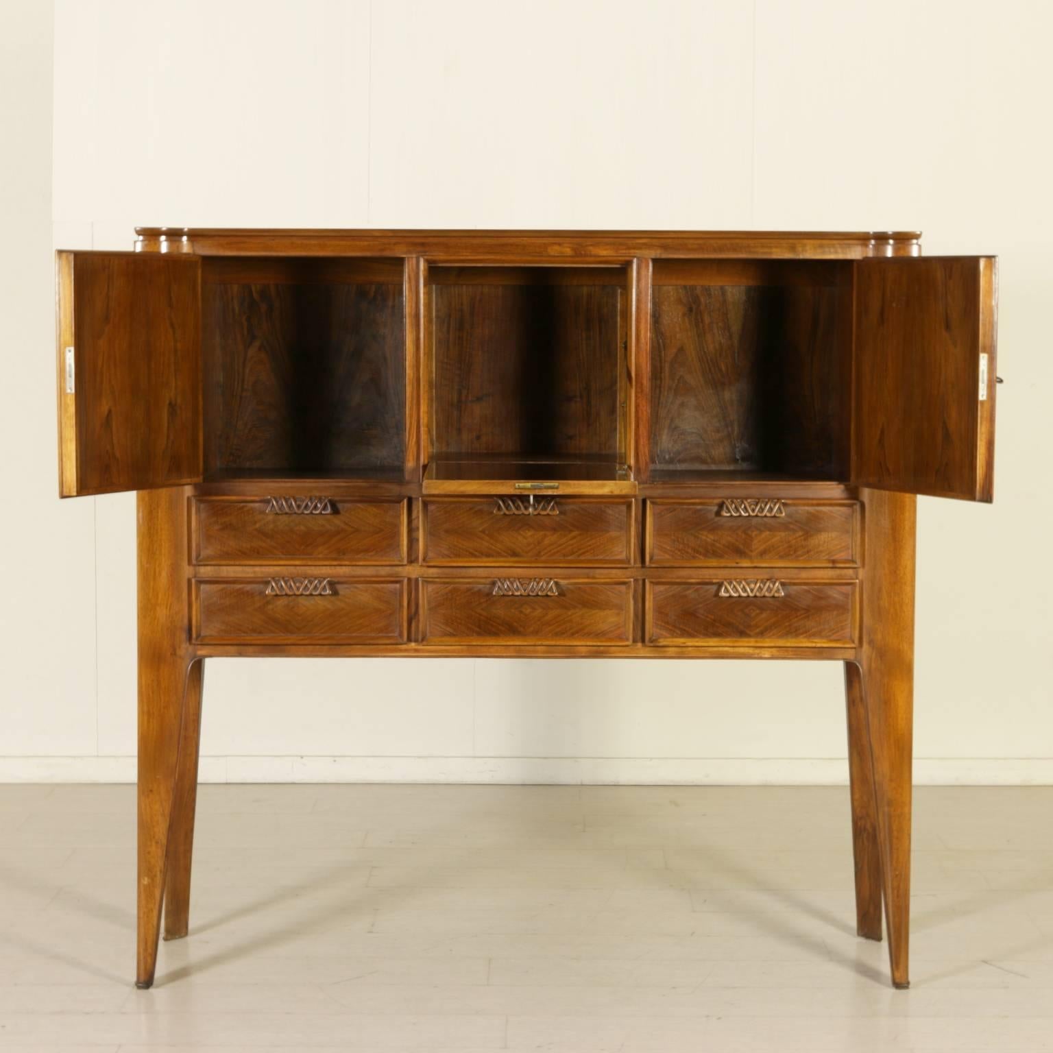Swinging cabinet with drawers, root veneered wood, handles in carved wood. Manufactured in Italy, 1950s.