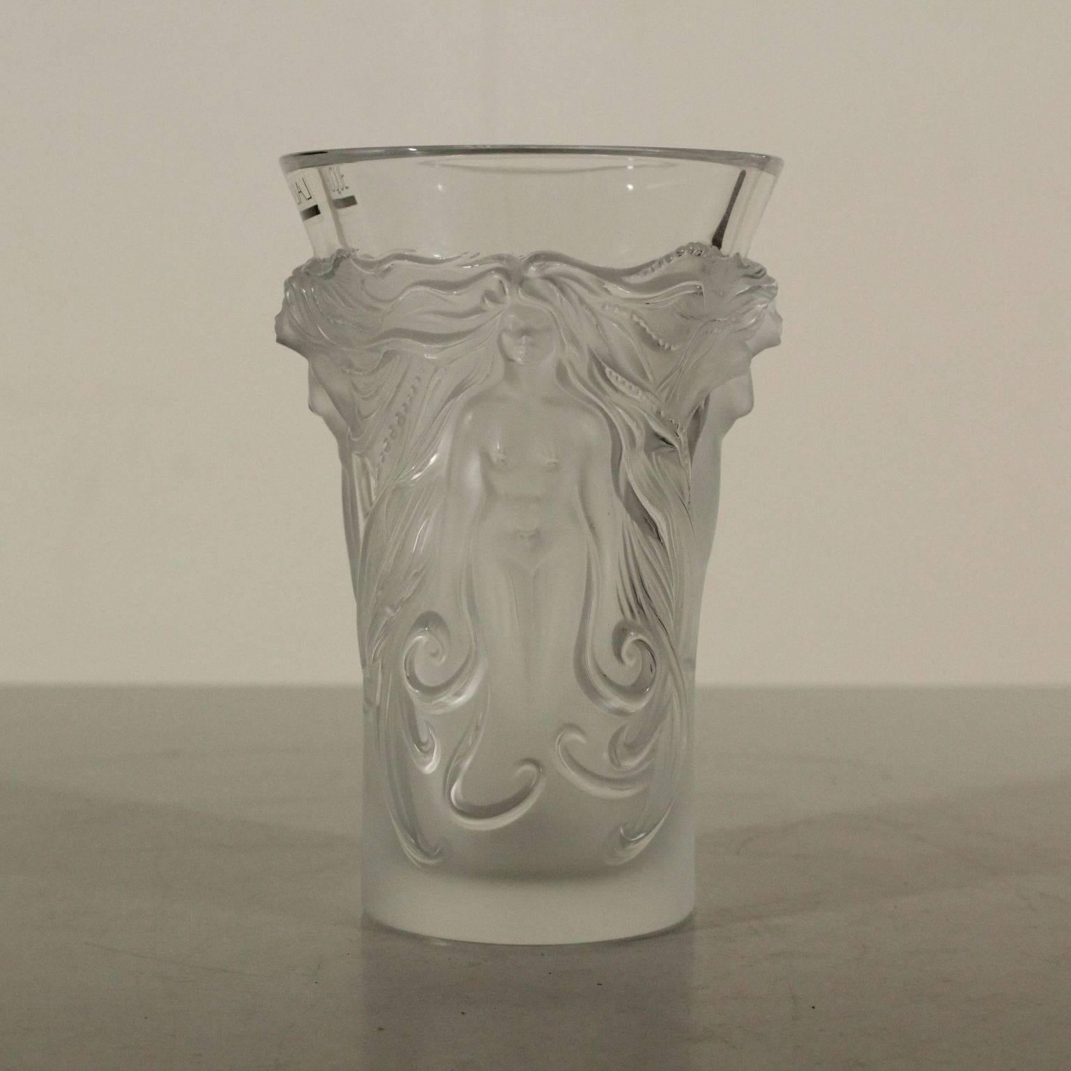A crystal vase by Lalique with all-round relief decoration, depicting nymphs. Original label on the edge and manufacturer's signature underneath the base. Manufactured in Paris, France, second half of the 20th century.