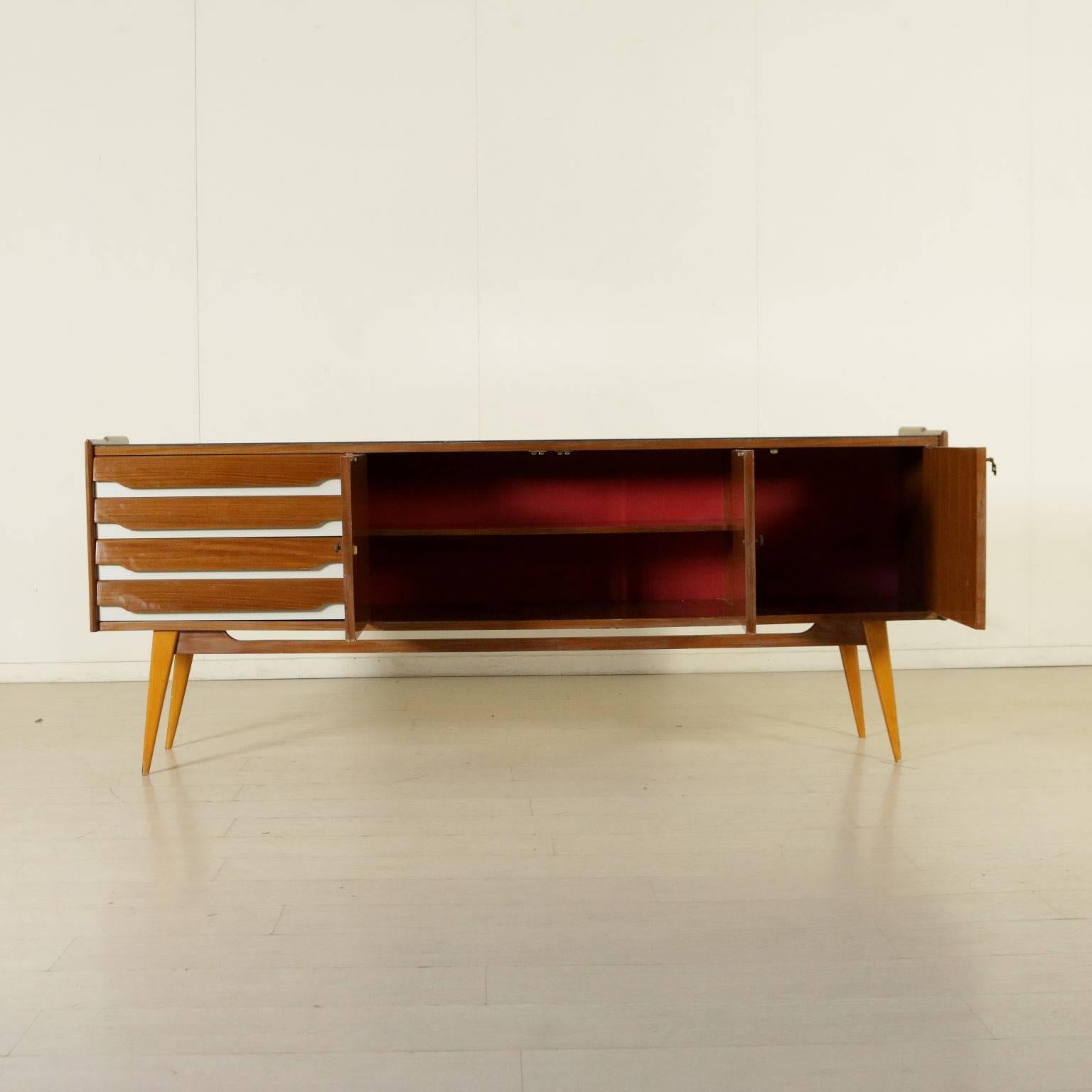 A sideboard, mahogany veneer, formica inserts, back-treated glass. Manufactured in Italy, 1950s.