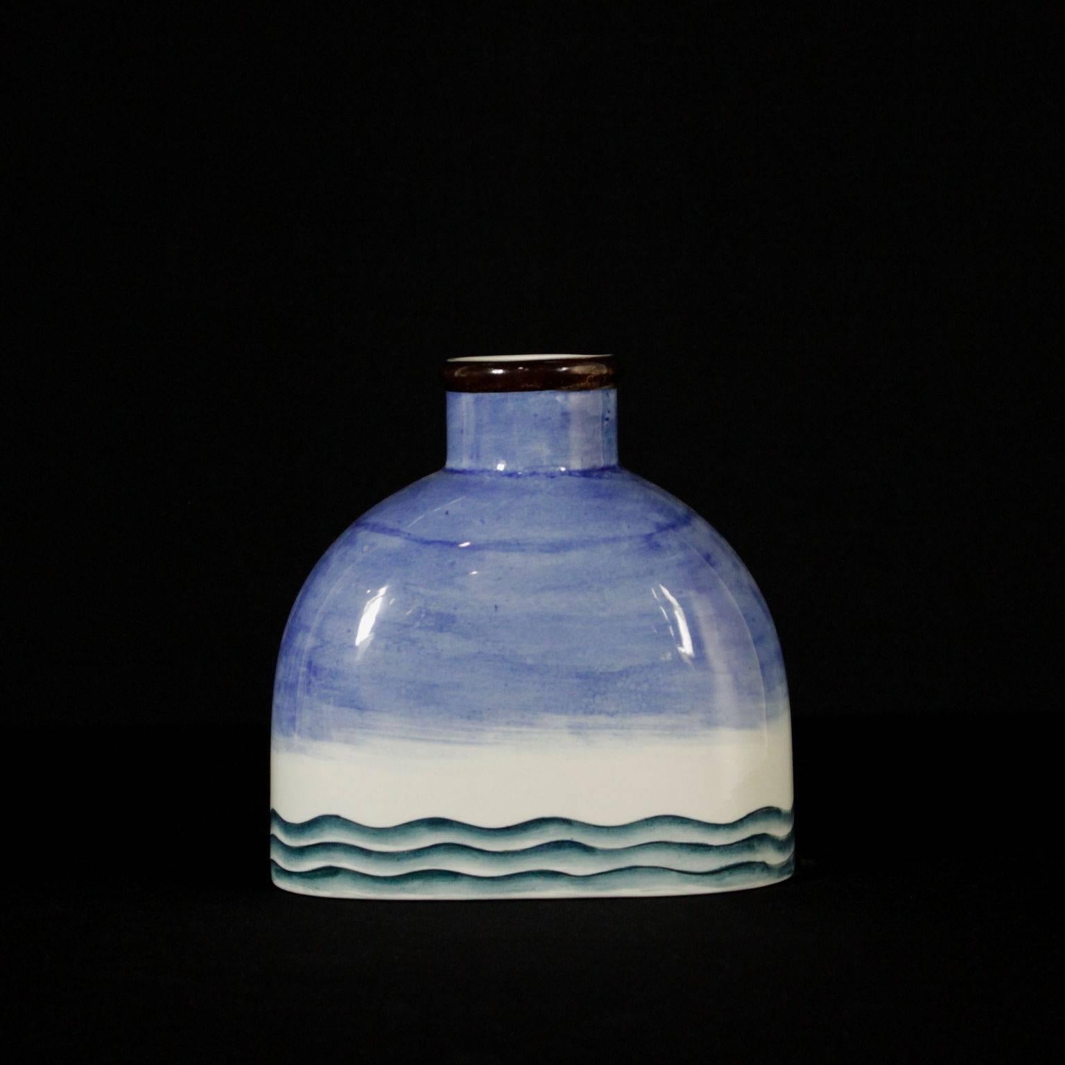 A bottle shaped ceramic vase with sailing ship decorations. Designed by Gio Ponti, manufactured by Richard Ginori-San Cristoforo Milano, as in the brand beneath the base. Firenze, Italy, 1930s.