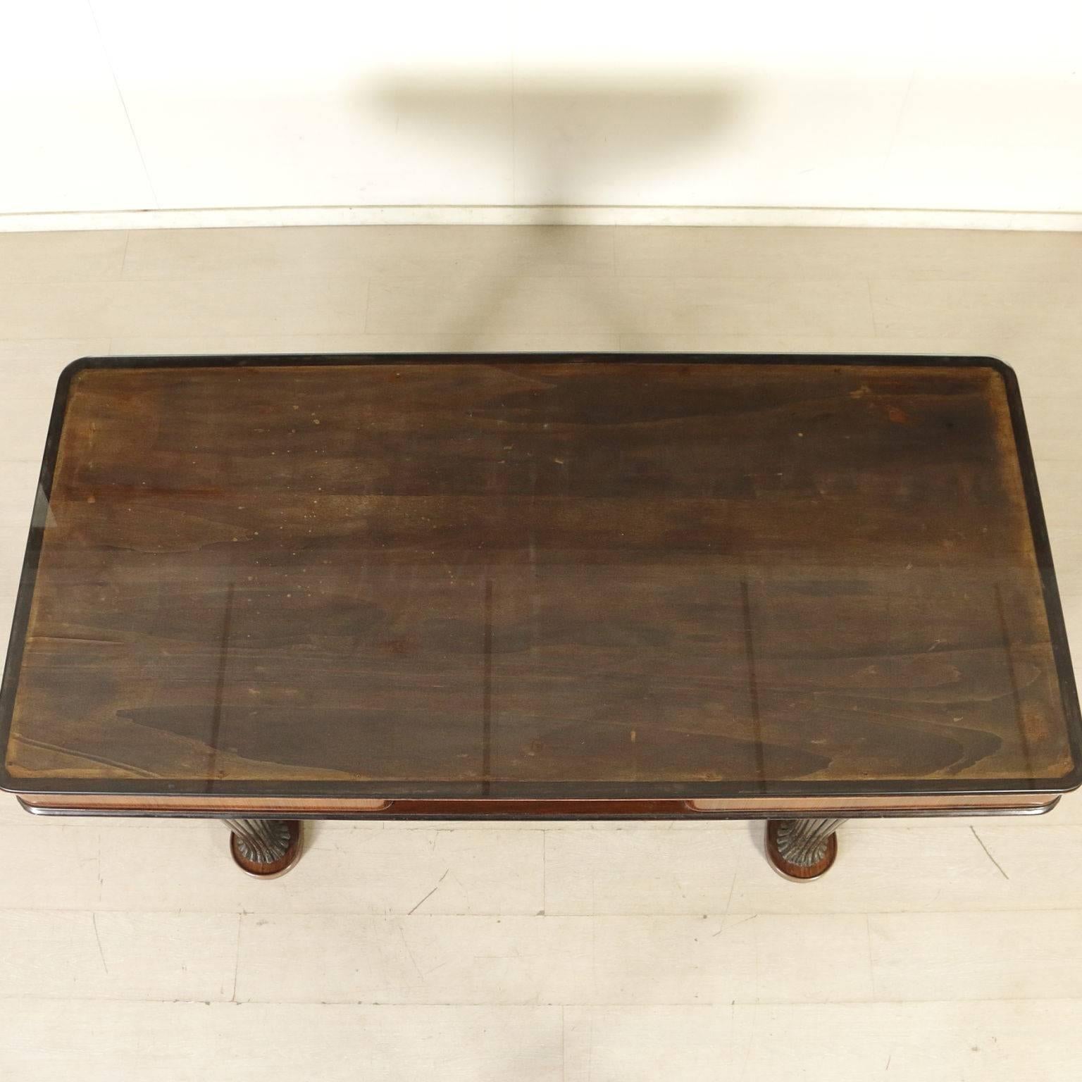 A table with carved wooden legs, rosewood veneered band, opal glass top, brass. Manufactured in Italy, 1950s.