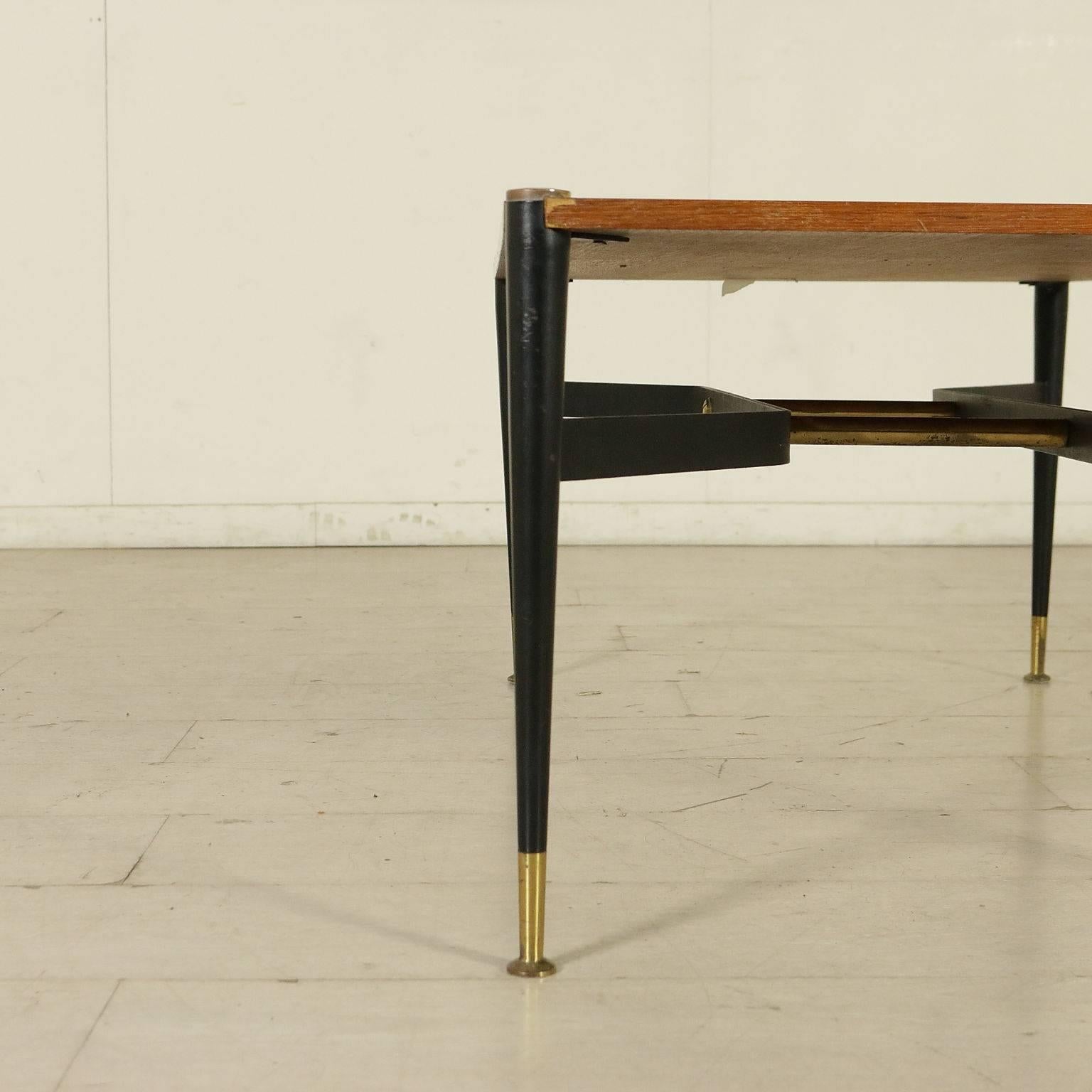 A coffee table, teak veneered wood, metal and brass. Manufactured in Italy, 1960s.