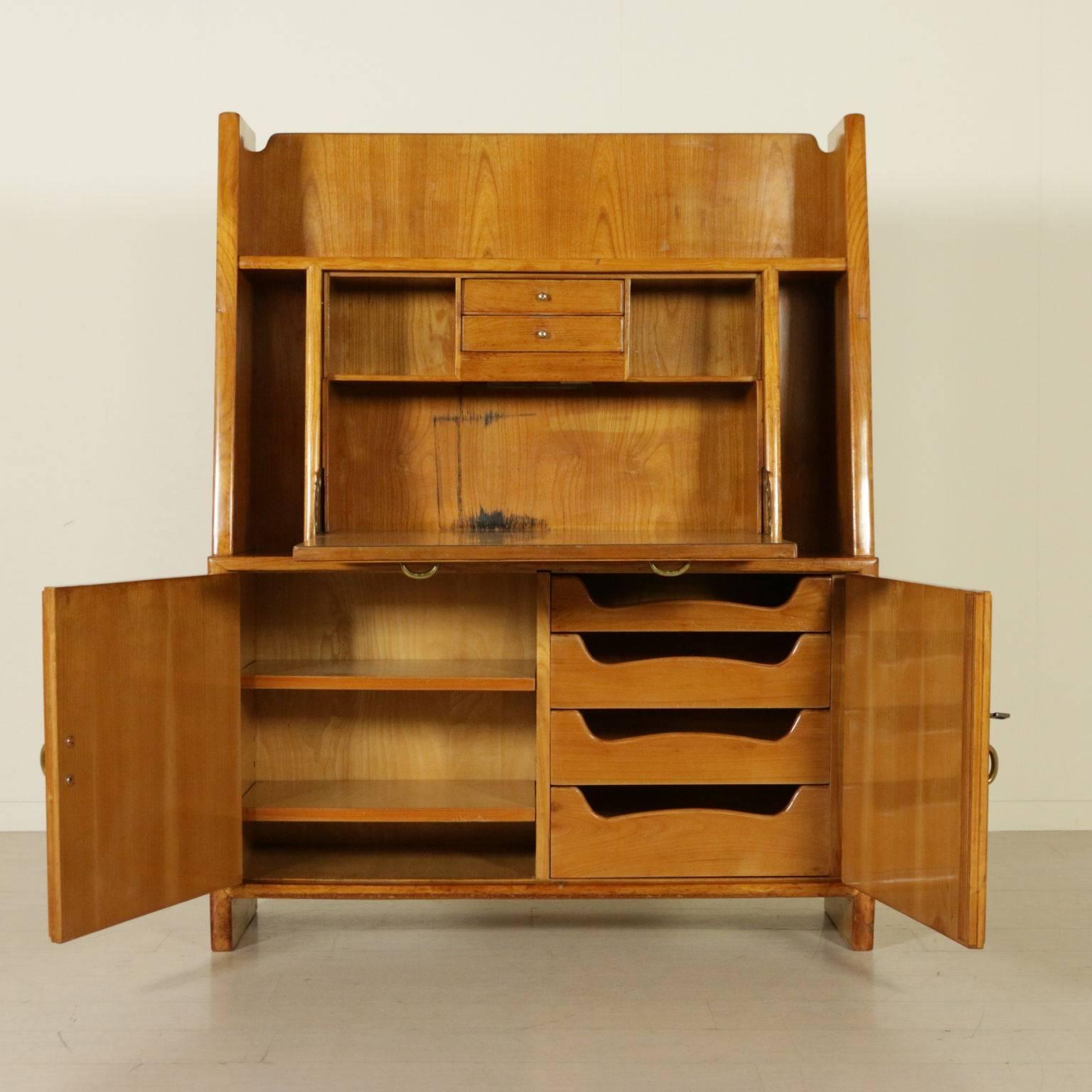A fall-front desk designed in the style of Osvaldo Borsani, maple veneer and brass handles. Manufactured in Italy, circa 1952