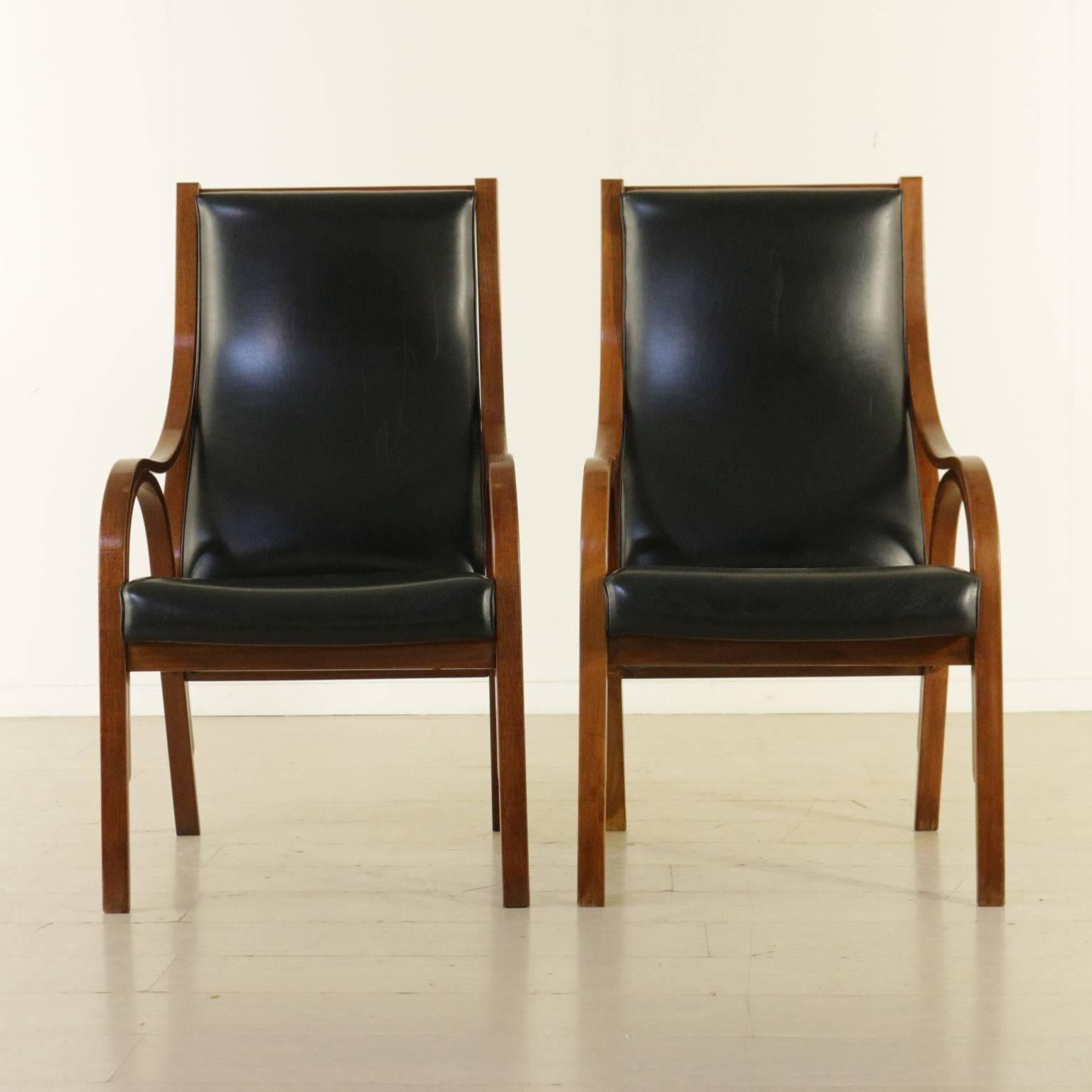 A pair of Cavour armchairs designed by Giotto Stoppino, Lodovico Meneghetti and Vittorio Gregotti for Sim. Made of laminated bentwood, curled hair padding and leatherette upholstery. Manufactured in Italy, 1960s.