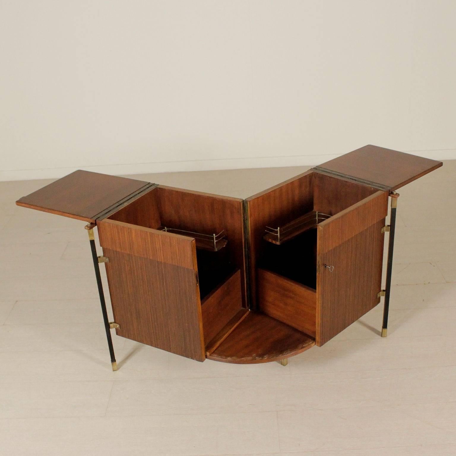 A foldable bar cabinet, rosewood veneer, metal and brass. Manufactured in Italy, 1960s.