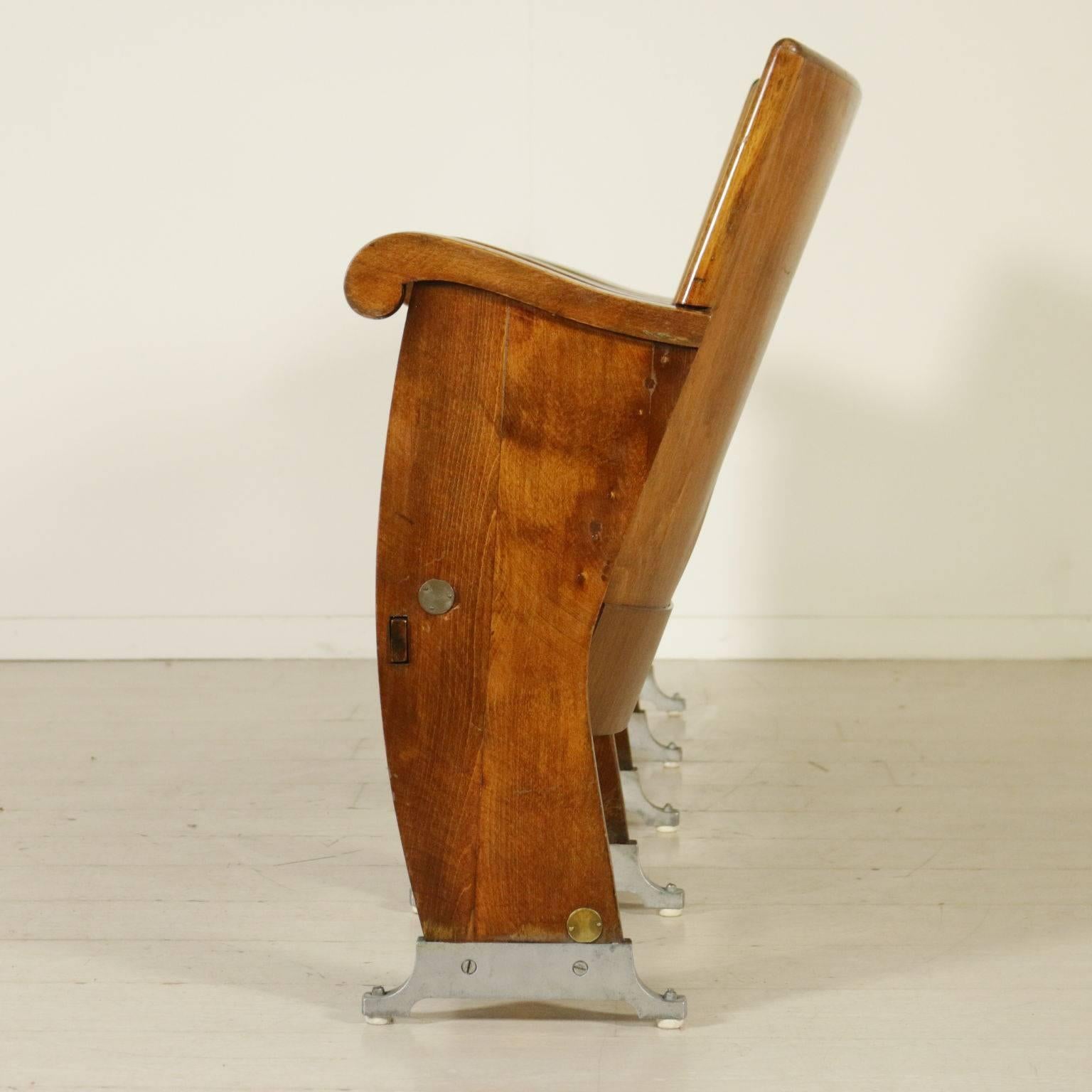 A line of cinema chairs with drop-leaf seat, beech and poplar plywood. Manufactured in Italy, 1960s.