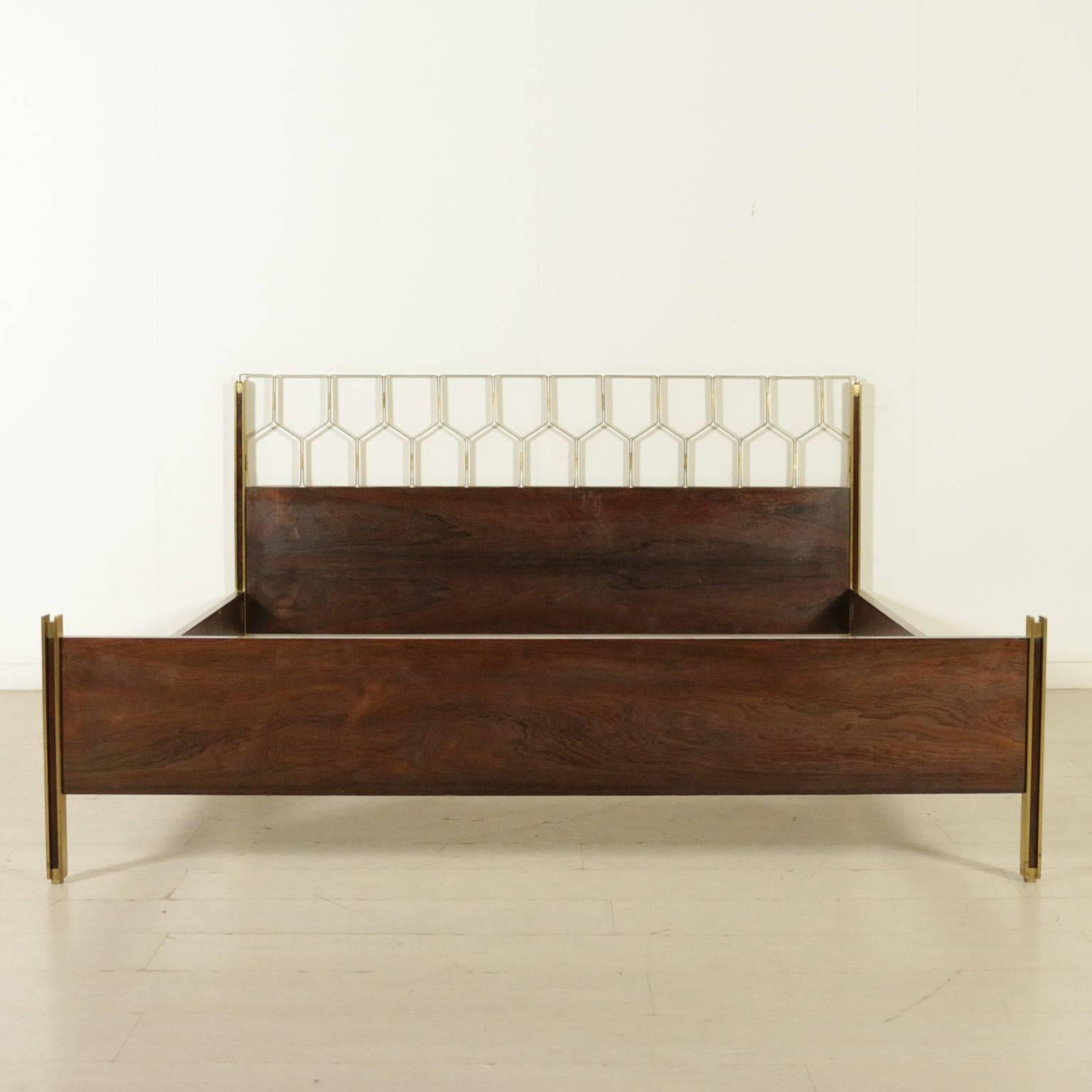 A double bed, rosewood veneer and brass. Manufactured in Italy, 1960s. 