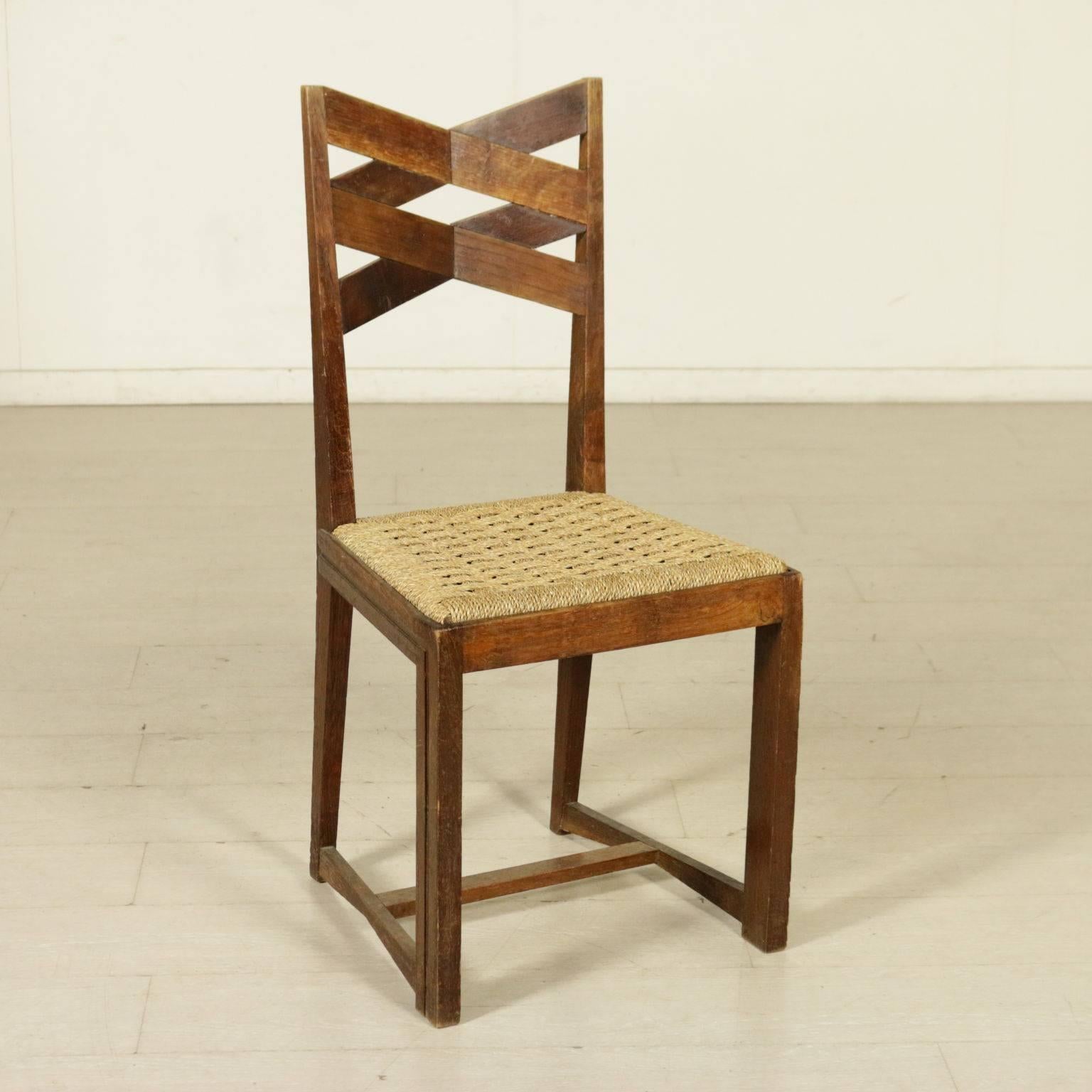 A group of four chairs, oak wood, seat made of intertwined rope. Manufactured in Italy, 1940s.