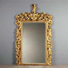 Espejo de estilo barroco de madera de pino cembro dorada, Italia, siglo XIX