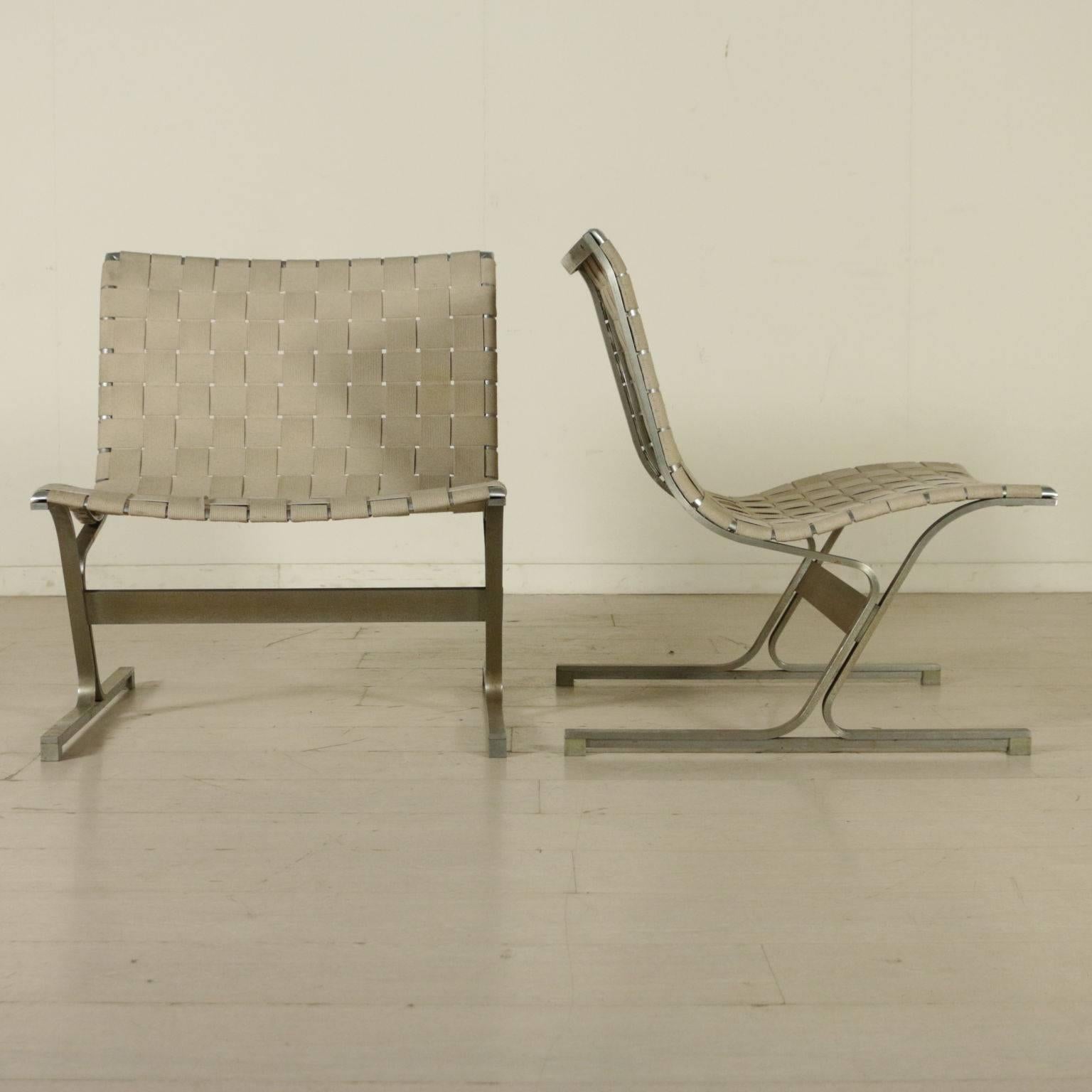 A pair of armchairs designed for ICF, steel structure, back and seat with weave bands. Model: PLR 1. Manufactured in Italy, (Vignate), 1970s.