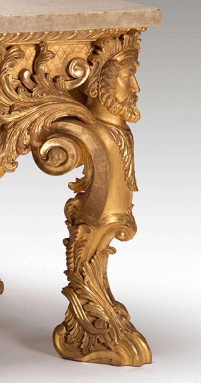 Table console en bois doré exceptionnellement sculpté d'après un modèle de Matthias Lock. La frise sculptée est soutenue par des pieds en forme d'Herm centrés par un buste sculpté de Diane. L'ensemble de la table est richement sculpté de rocailles,