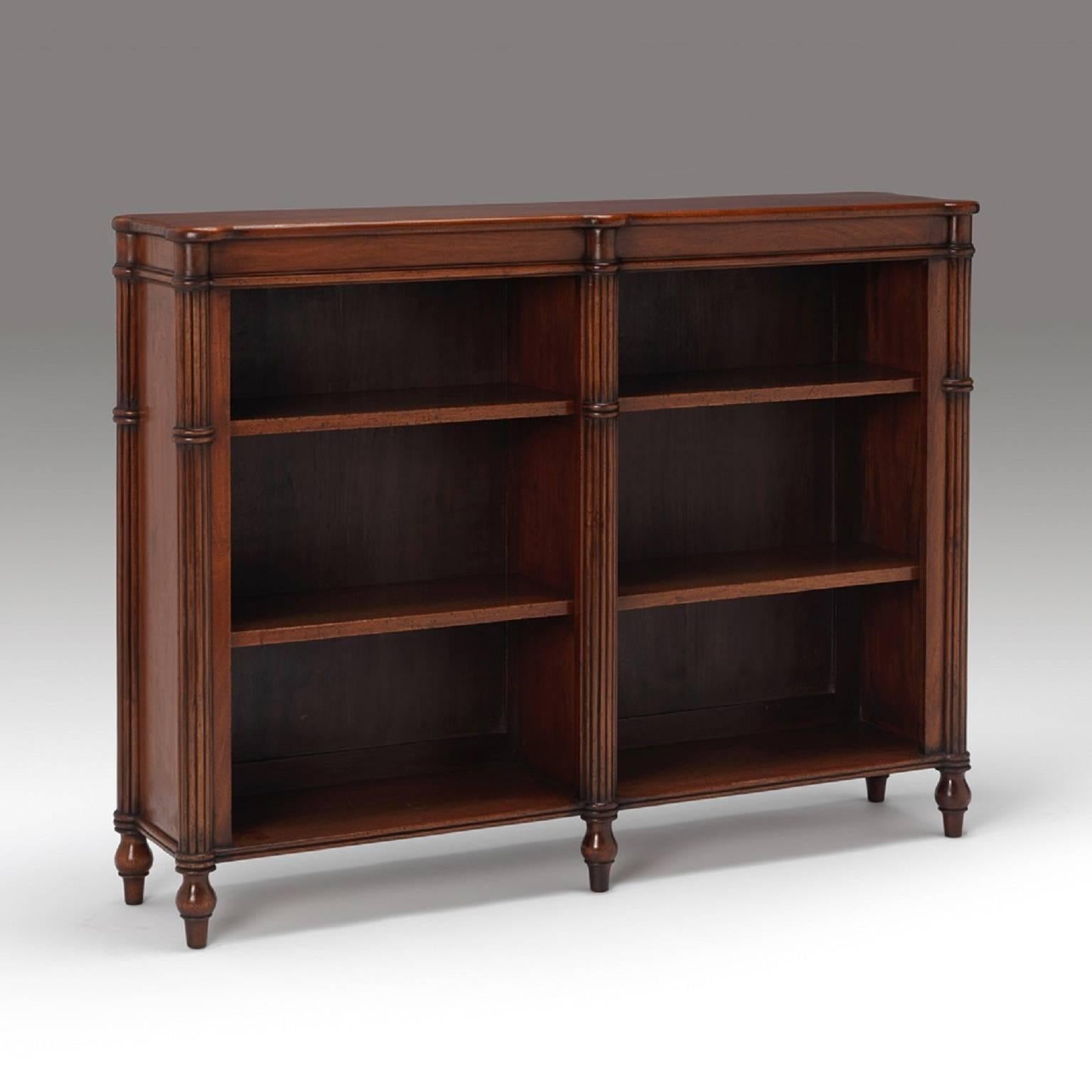 A pair of regency style mahogany open bookcases with reeded central, end pilasters and adjustable shelves all resting upon elegant torpedo design feet.

We are currently working to a 30-36 week lead time. 