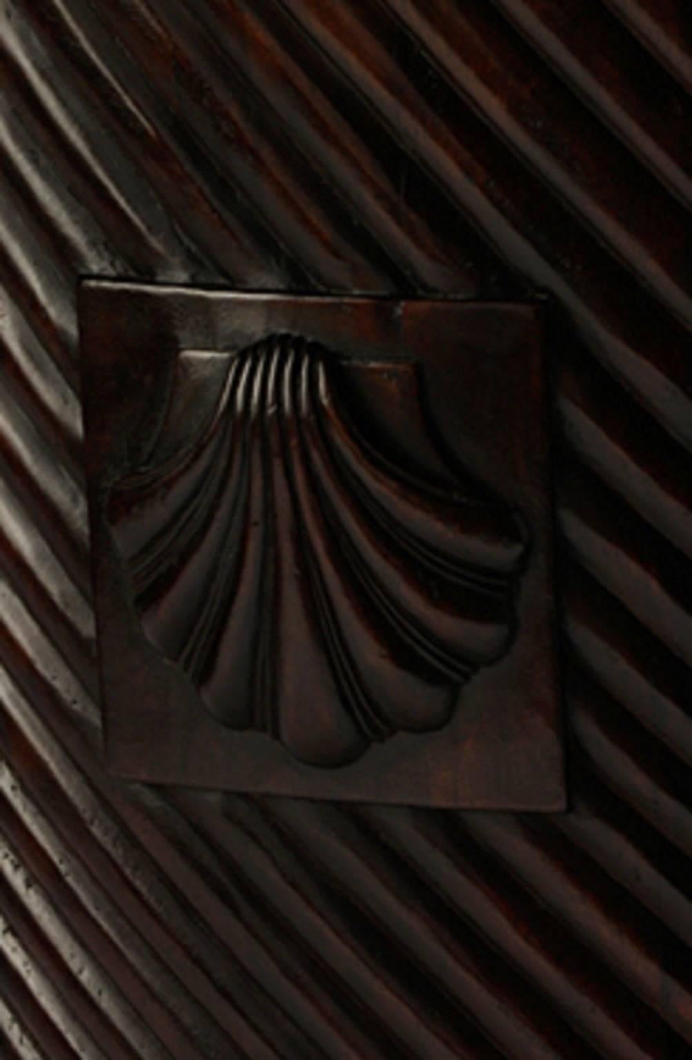 A unique pair of monumental brass bound mahogany Irish Georgian style turf or peat buckets with shell motifs. The fitted brass liners makes them especially suitable for logs or indoor palm tree use. Note the standard size peat bucket shown to the