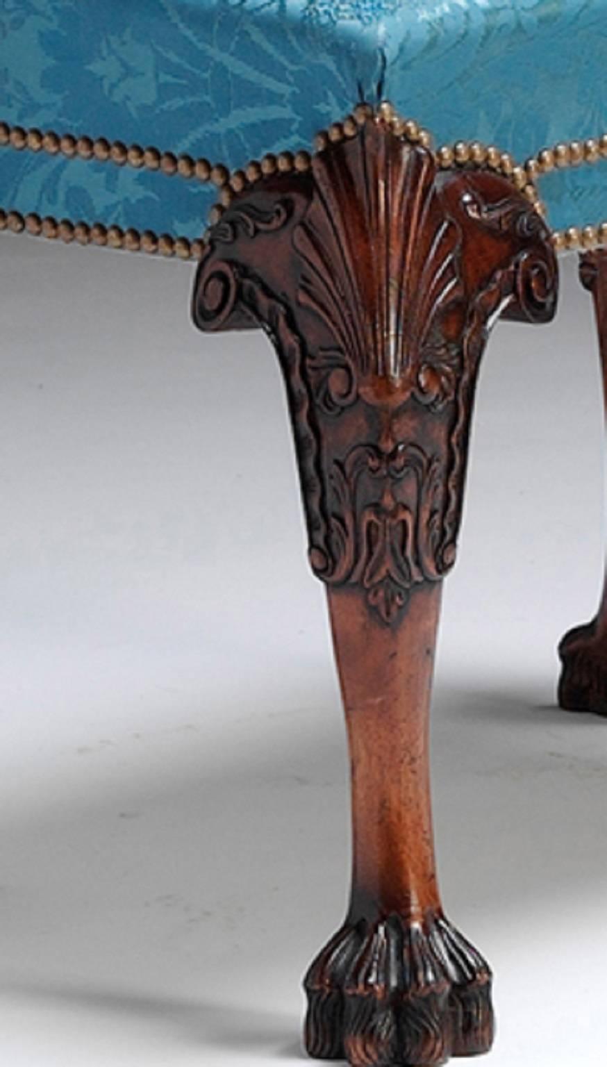 A carved mahogany, upholstered stool in the mid Georgian manner with shell carved knees, acanthus decoration and hairy paw feet.

We are currently working to a 30-36 week lead time. 