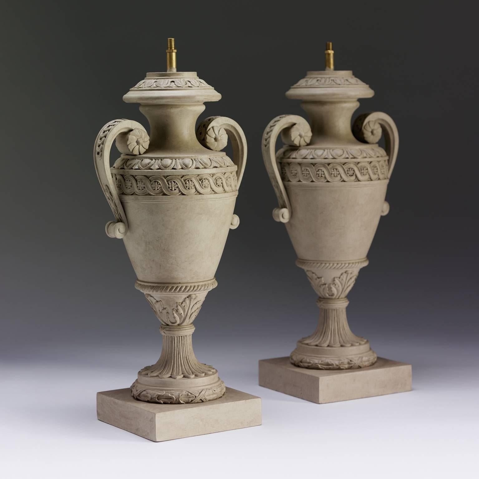 A fine pair of carved and painted Robert Adam inspired table lamps with guilloche and egg and dart decoration, on square platform bases.

We are currently working to a 30-36 week lead time.