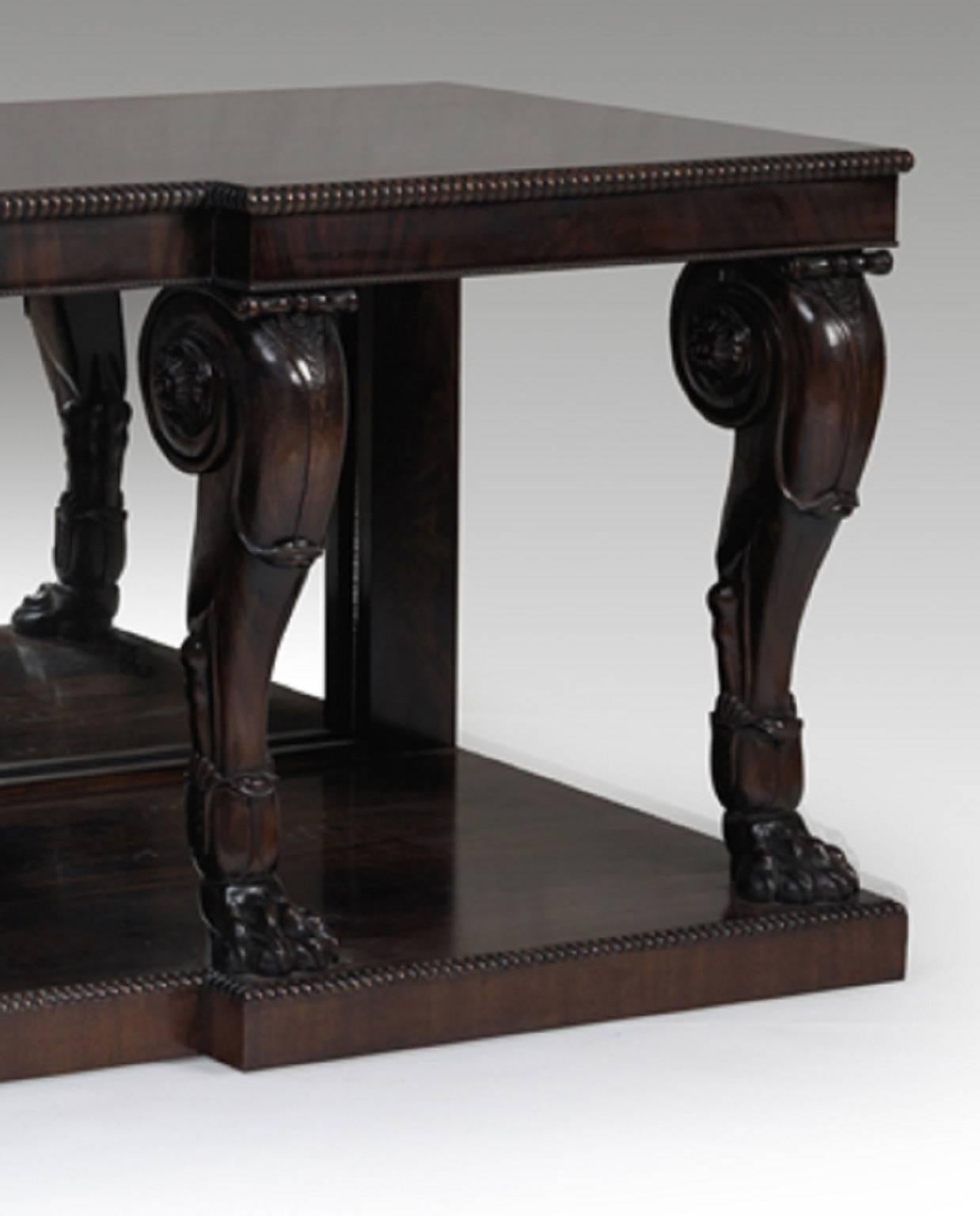 A pair of grand scale Regency design carved mahogany console tables with four Grand Tour inspired legs to the front, the backs inset with mirror panels, all sitting on singular plinths bespoke polished and aged to appear of the period. These