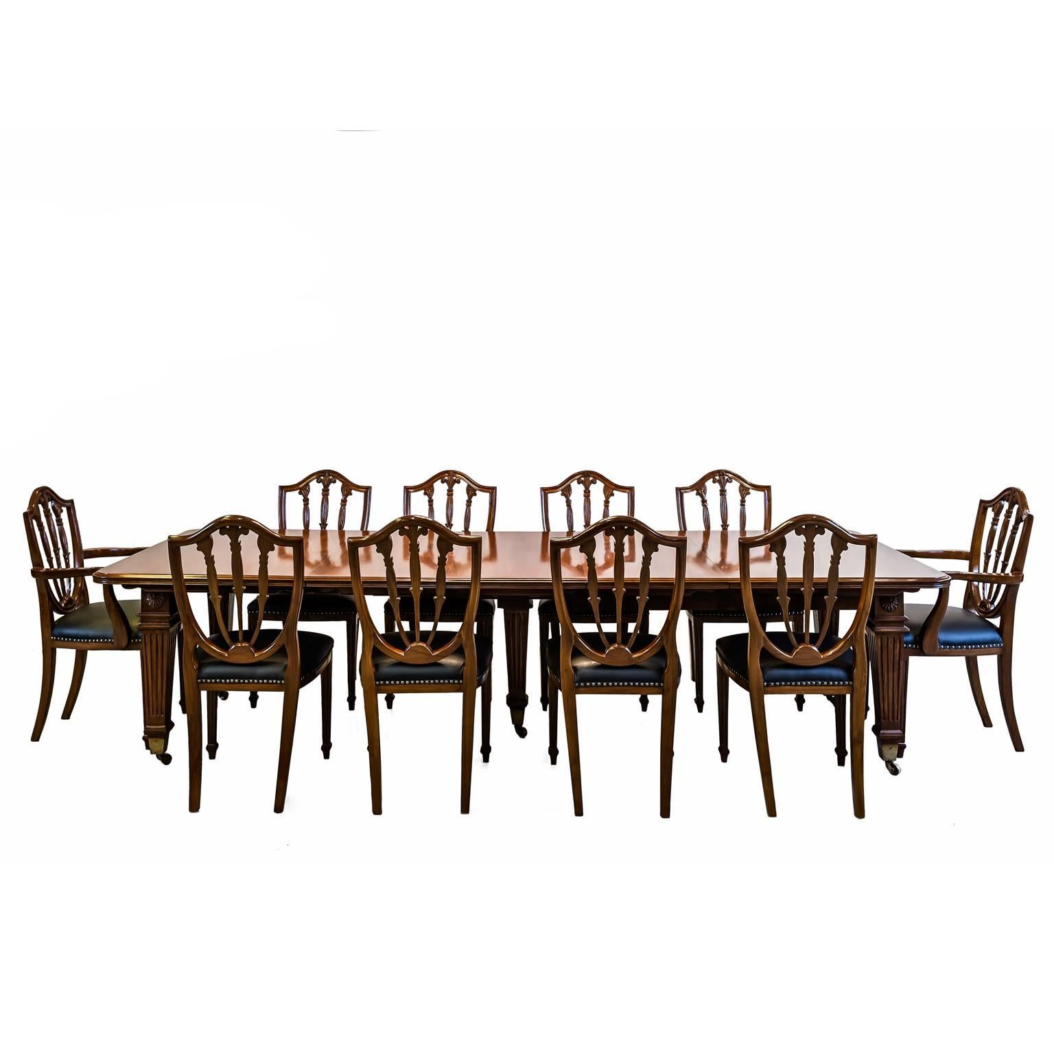 Anglo-Indian or British Colonial Teakwood Extending Dining Table with Ten Chairs
