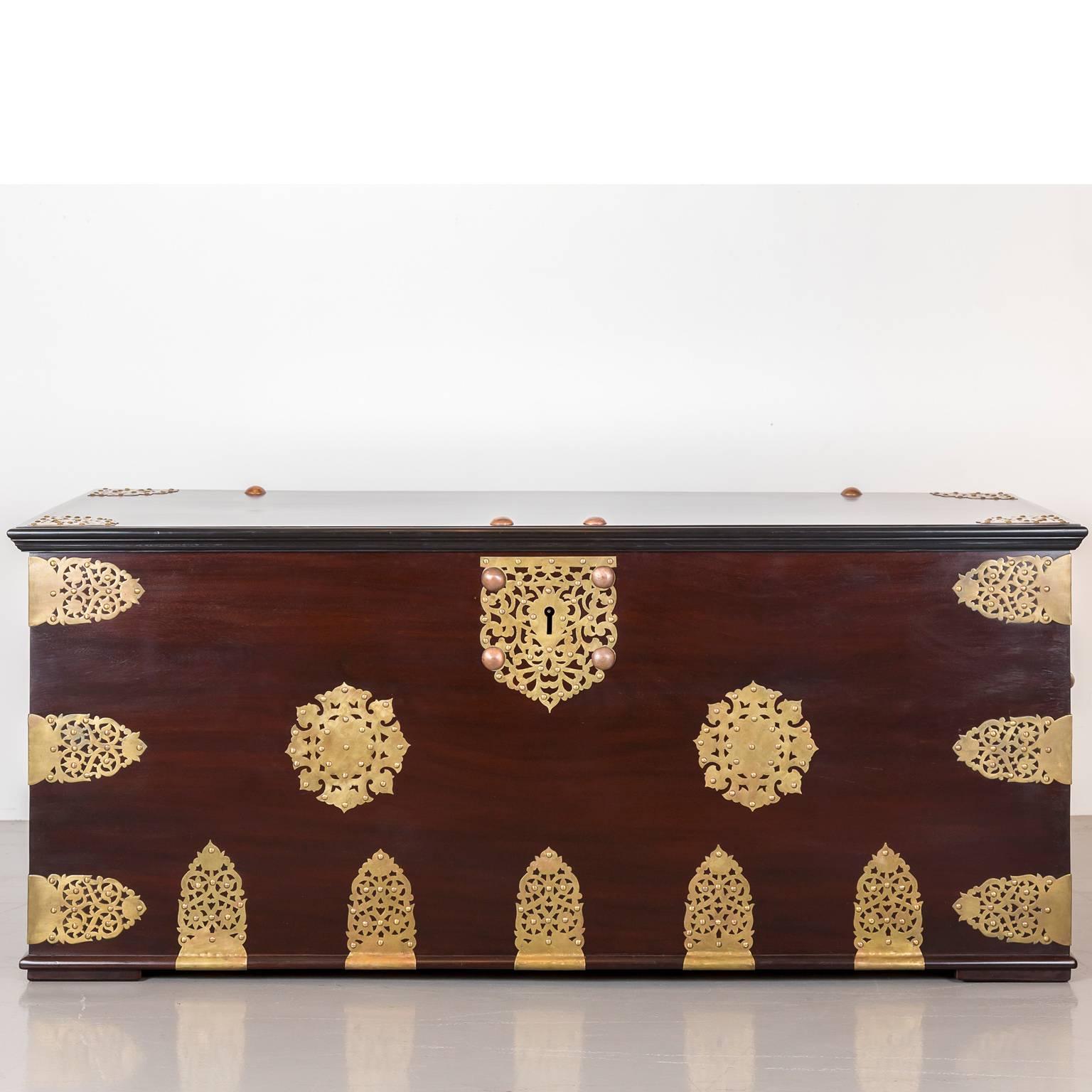 An absolutely stunning and unique Dutch colonial very big storage chest, on all six sides made of single planks of rare Cuban mahogany. It incorporates both Mughal and Dutch influences. The overlapping top with an ebony border. The chest is