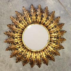Round bronze starburst mirror
