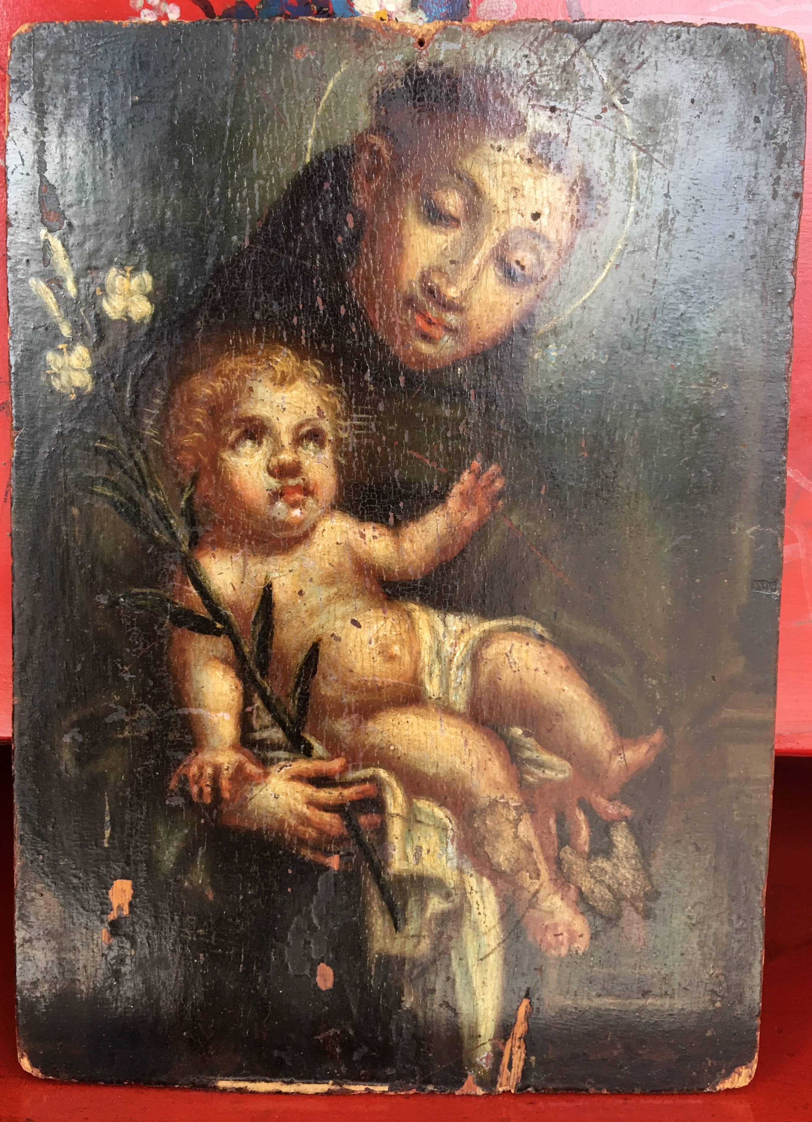Original oil on panel of Saint offering the Child, by an unidentified artist.

--This painting represents St. Anthony of Padua.  The scene is one that is often chosen to represent him: his fellow Franciscans looked out the window one day and saw a