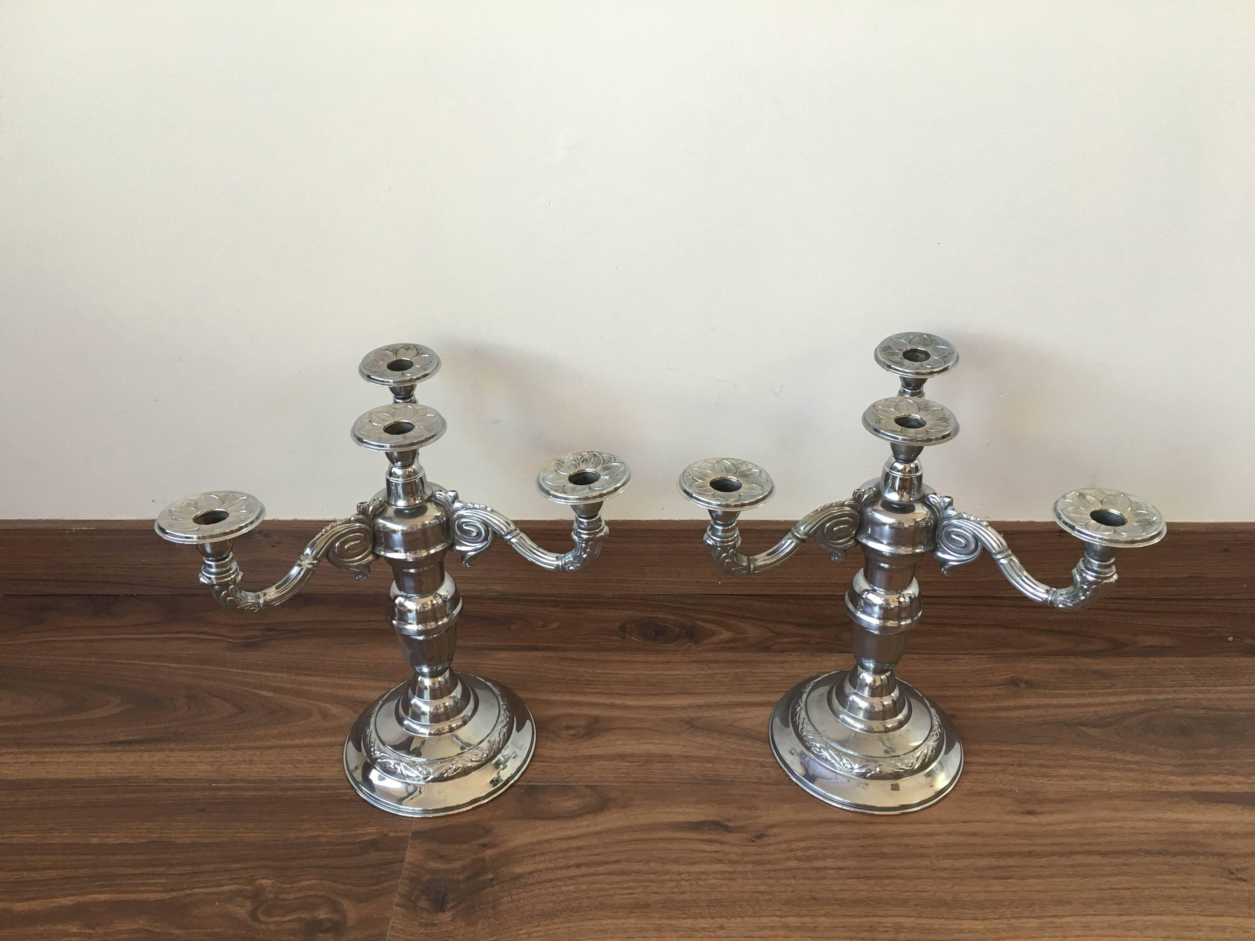 A pair of four-armed Art Deco candlesticks. 1930s-1940s, Sweden. In very good condition. Unclear stamp.