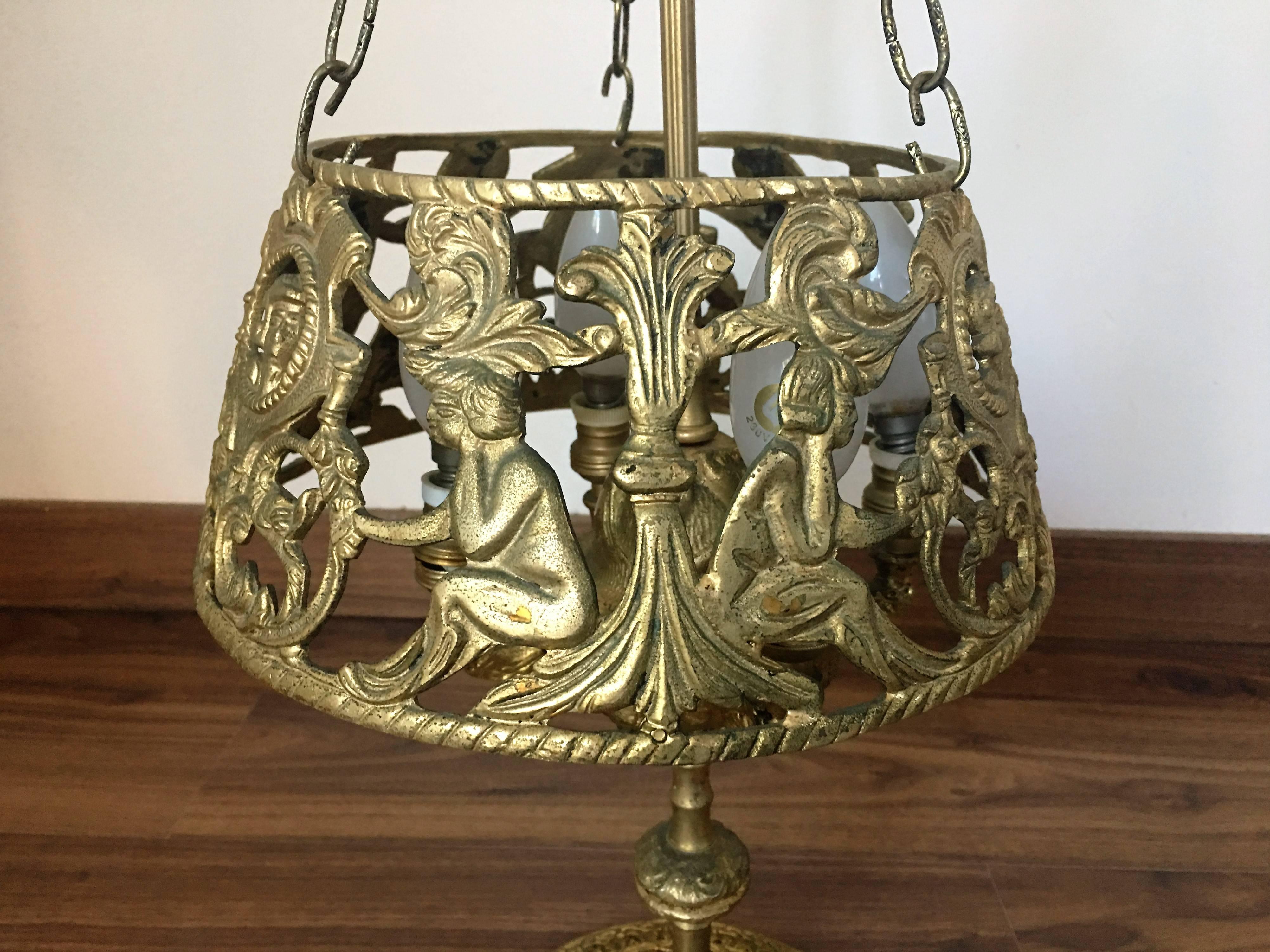 Wonderful French Bouillotte four-light lamp.
Beautiful etched detail on base and up the center. Tole lampshade in wonderful condition.