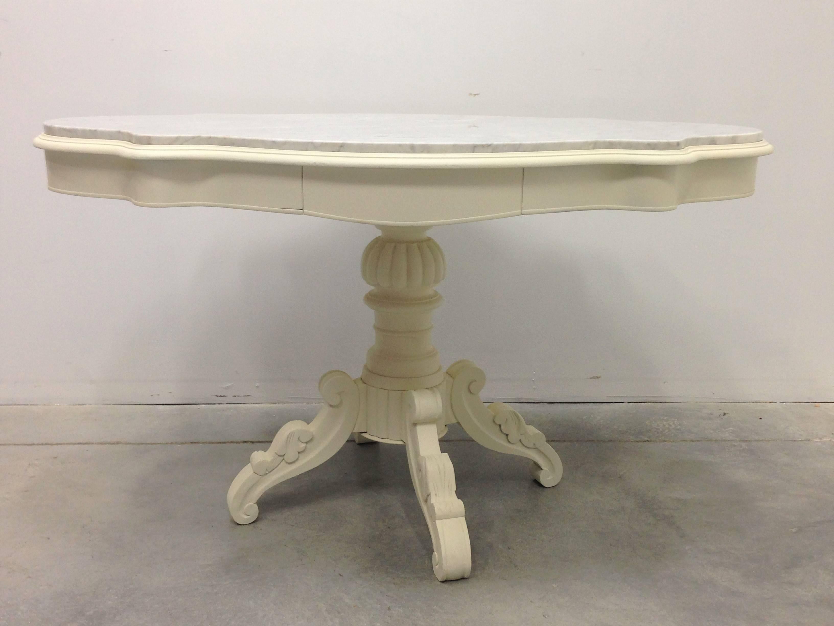 19th century Swedish pedestal table.

A charming oval pedestal table with base supported by beautifully carved four legs, 
Sweden, circa 1840-1850.

Charming Belgian table has a marble oval top and apron.

Clear matte finish seals the