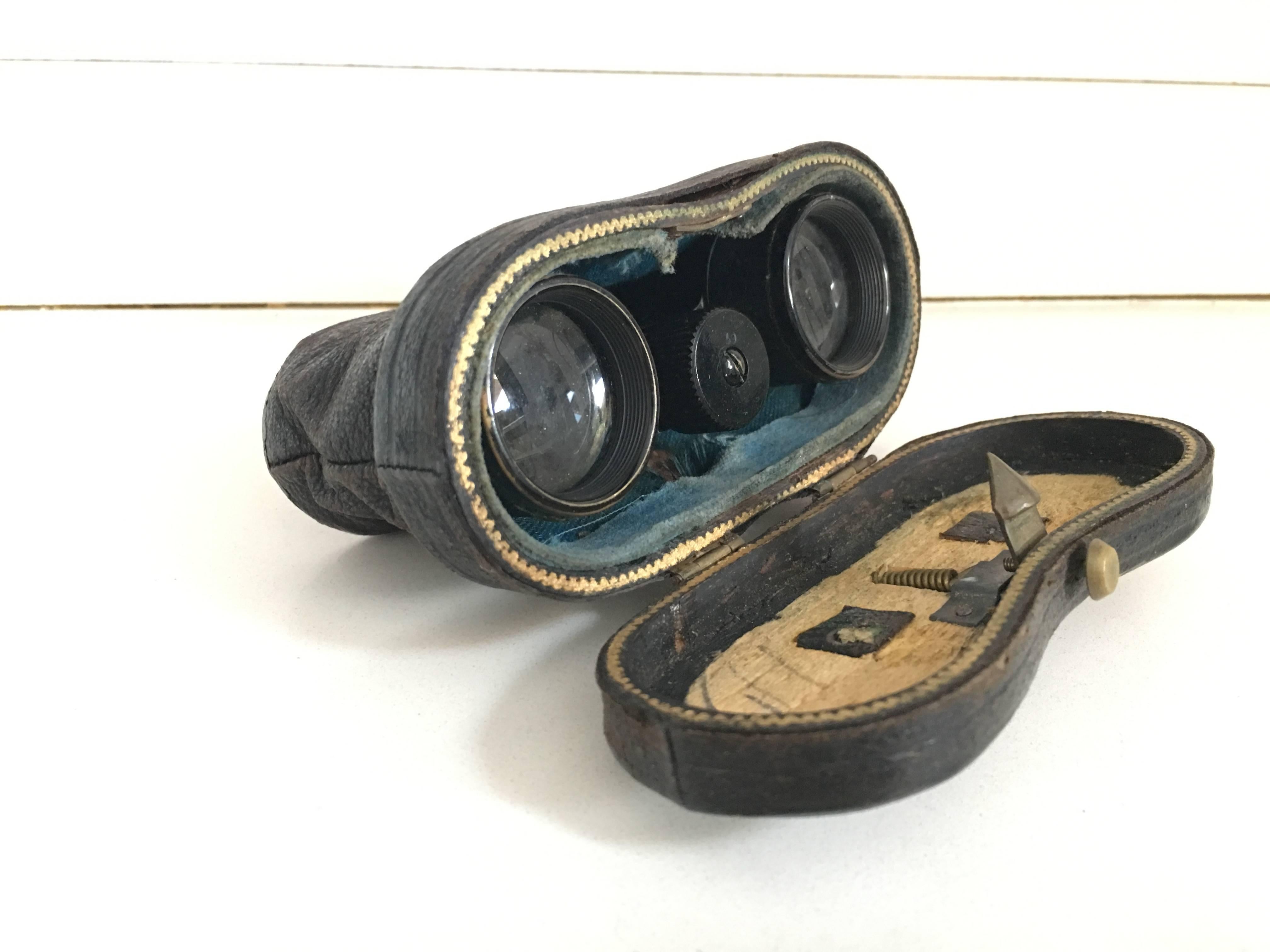 Binoculars opera glasses with leather case.