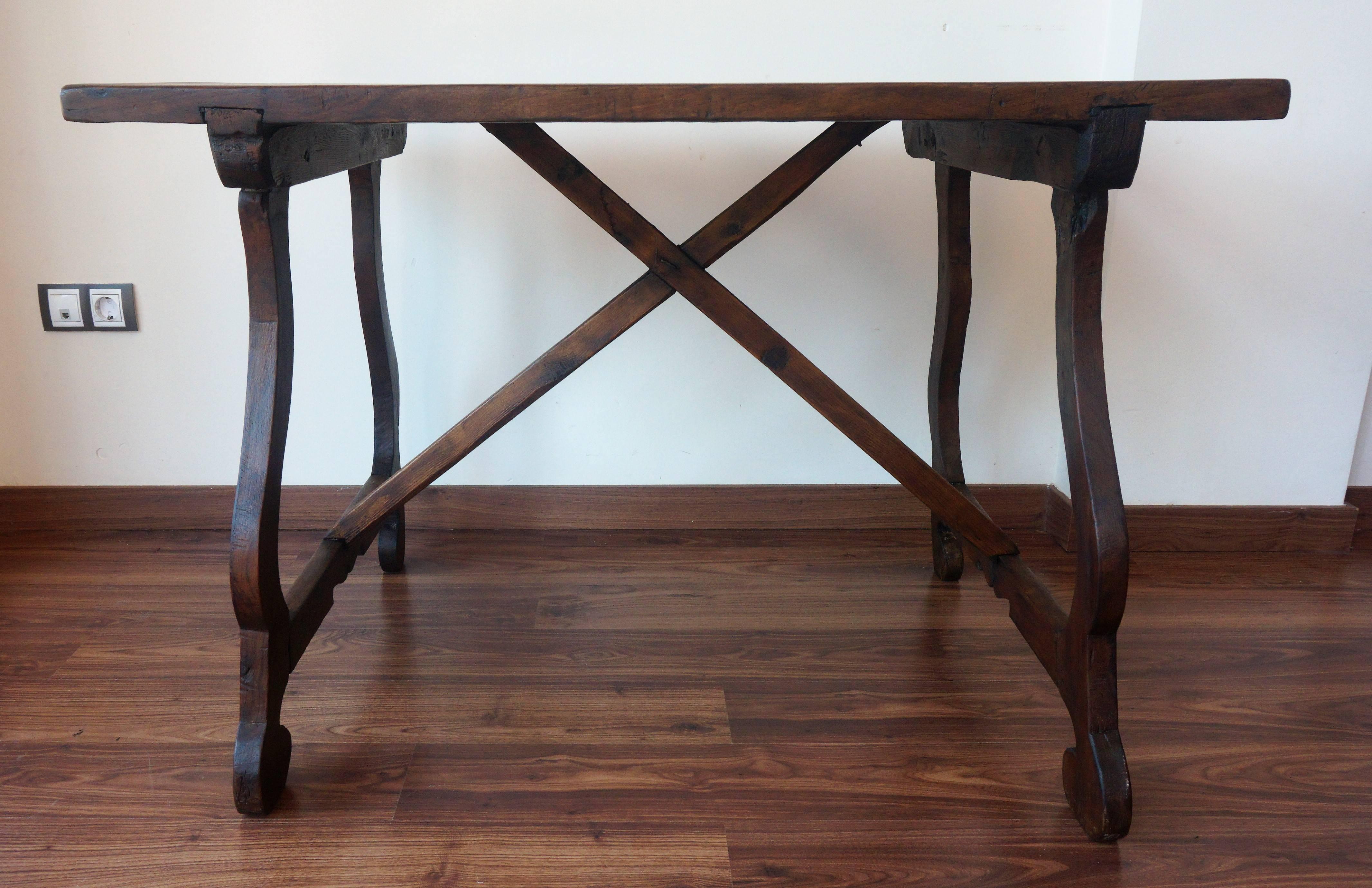 This chestnut refectory table with lyre or harp legs form. Its robust but elegant style will definitely stand out in your home or office.

A refectory table is a long narrow table supported by heavy legs or trestles connected by stretchers, used