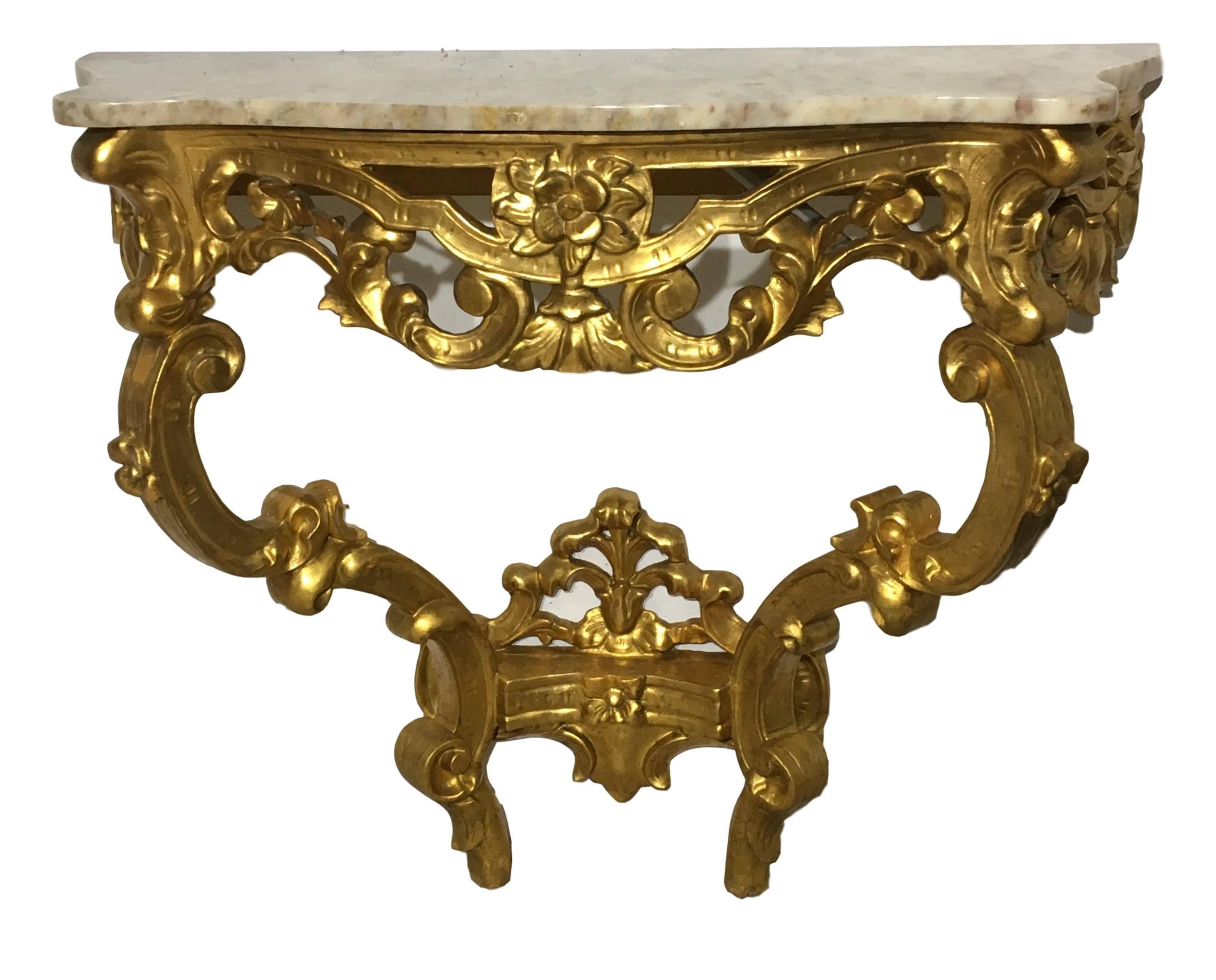19th Century Italian Carved Giltwood Marble Top Console
Ornate gilded wood and beautiful marble with wonderful scale.
Elegant carved details include shell and leaf forms, flowers and other ornamentation
This piece actually has a matching mirror as