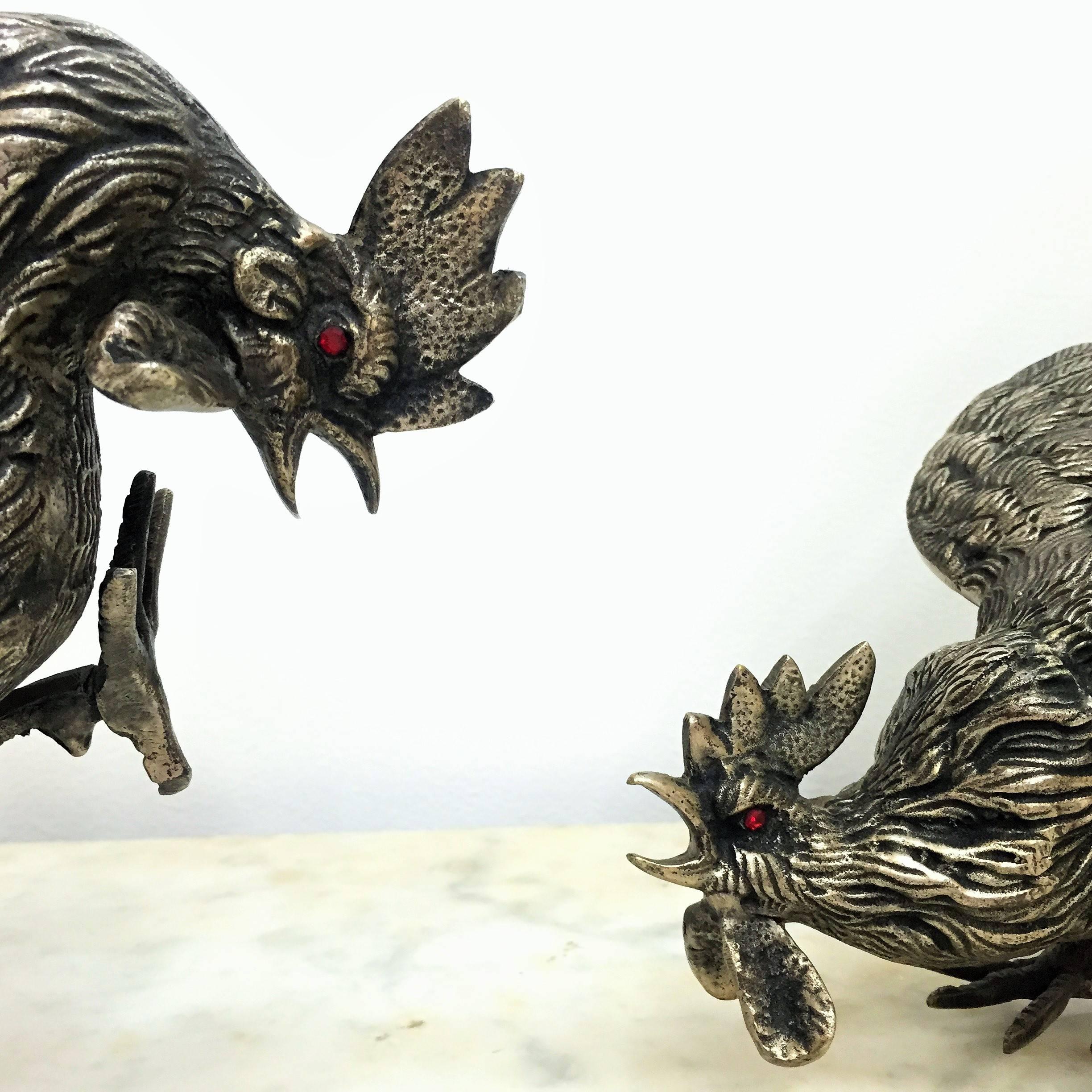 Pair of gamecocks in bronze with red eyes like 