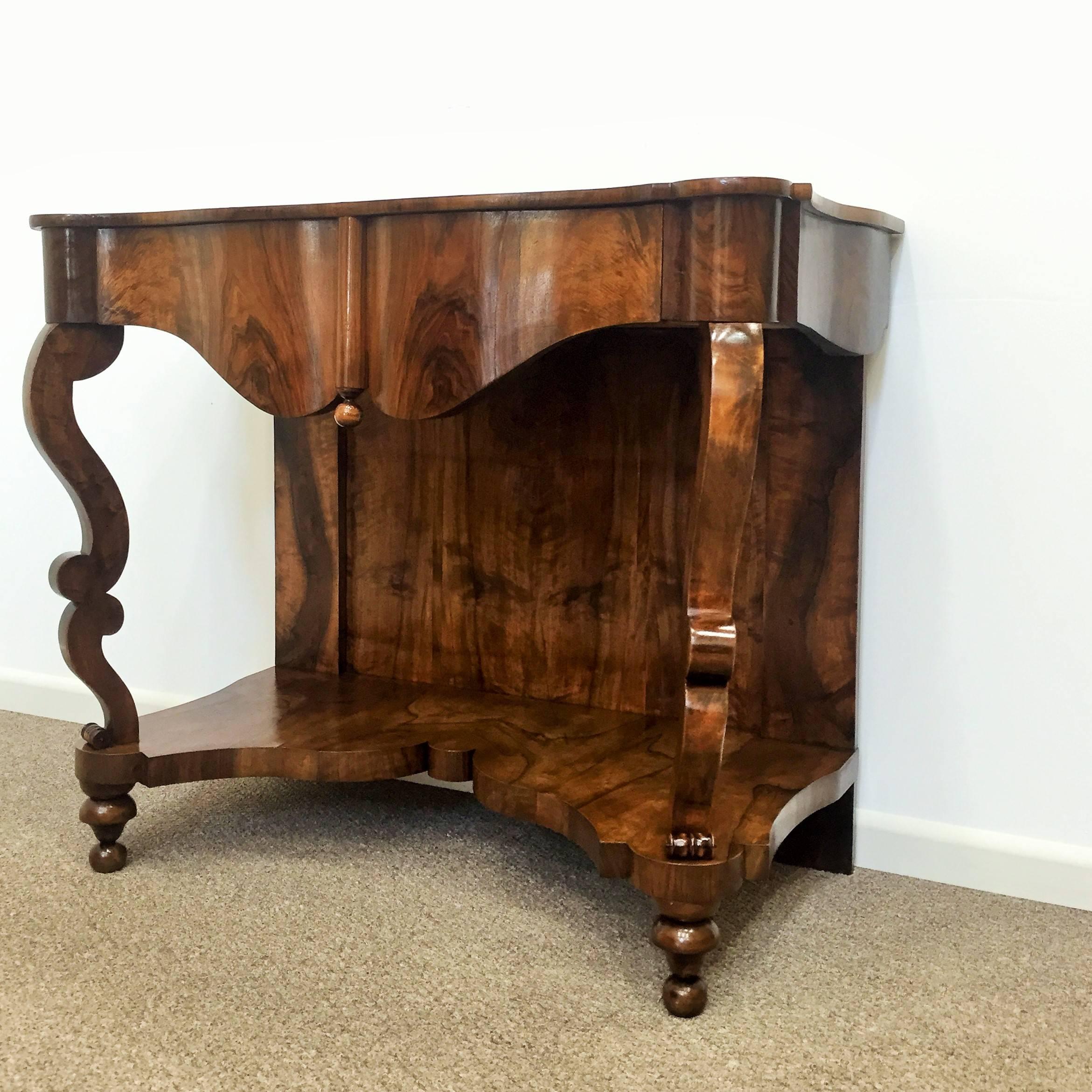 This very rare Biedermeier wall console was manufactured circa 1830 in Austria and features a hidden drawer which adds a sophisticated touch to its mysterious allure. A rare “one of a kind” piece!