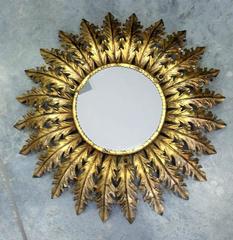 Round bronze starburst mirror
