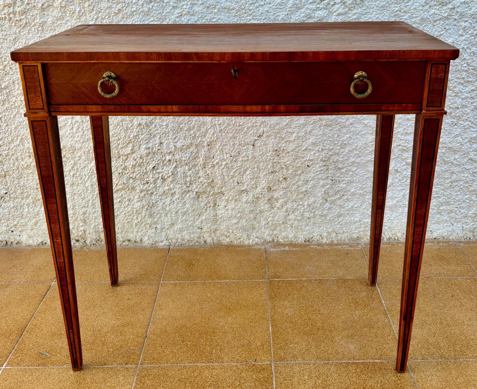 19th Spanish side table with cared Solomonic turned legs and iron stretcher. The top has a carved edges and a beautiful grain and patina.