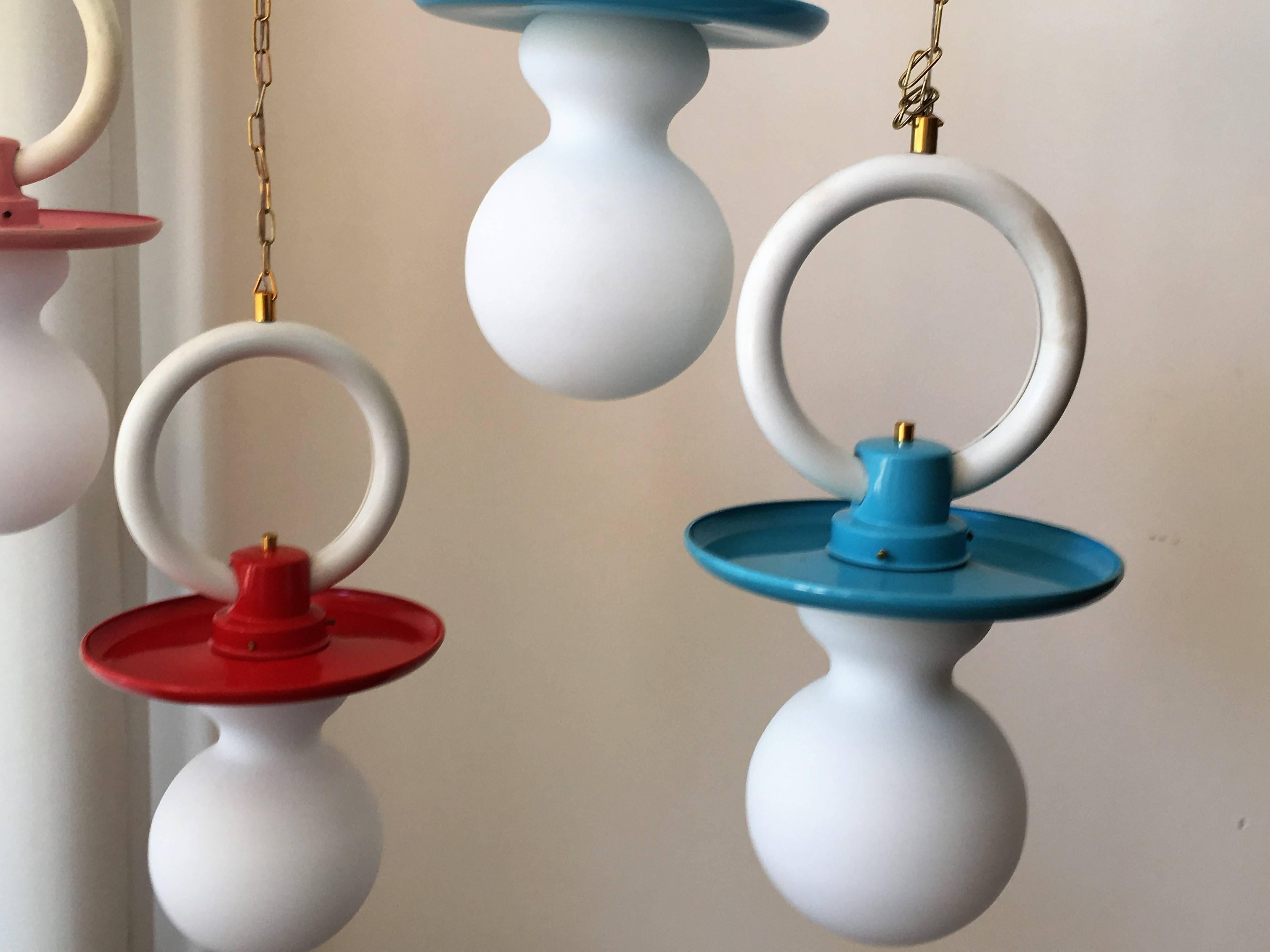 Set of five Art Deco kids lamps.
Two pink,
two blue and
one red.
Metal base and glass lampshade.

Measurements of white glass: Height 10in
