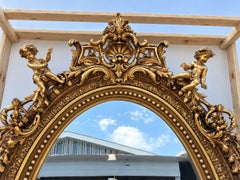 Baroque Revival French Giltwood Oval Mirror with Carved Cherubs, 92 Inches