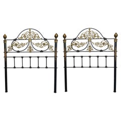 Pair of Antique French Black Iron and Brass Twin Bed Headboards with Ornate Flor