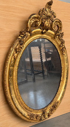 French Rococo Giltwood Oval Mirror with Carved Floral and Acanthus Crest
