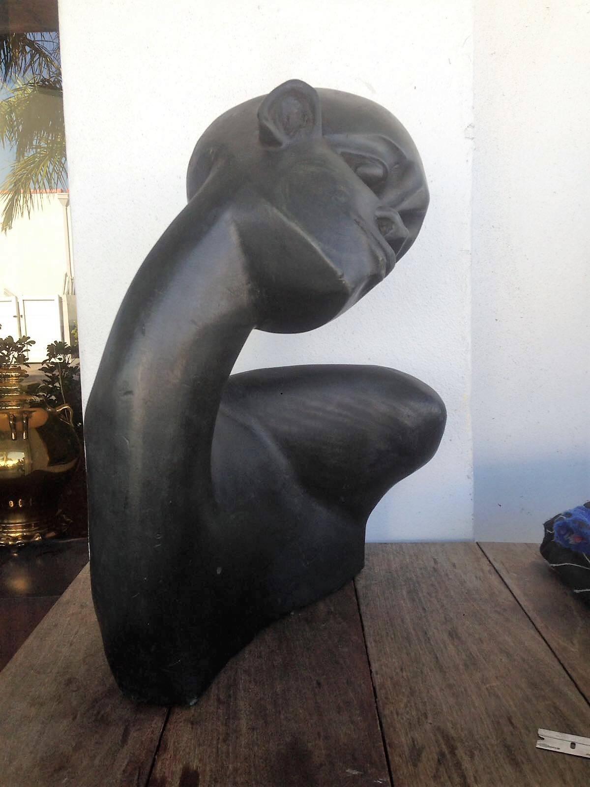 Beautiful carved ebony wood bust of African. This piece is a fine example of traditional wood carving techniques. Extremely powerful specimen with a lot of visual interest and presence.