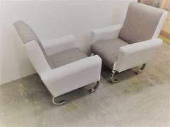 Mid-Century Exclusive Pair of Sleek Italian Armchairs with Curved Metal Base