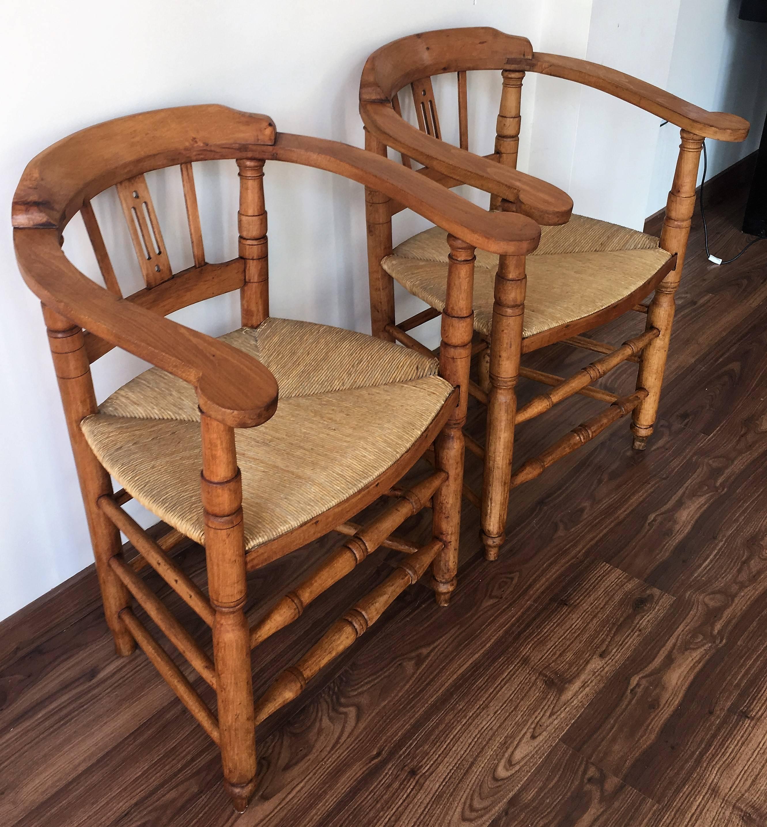 Pair of Spanish Horseshoe Back and Cane Armchairs 1