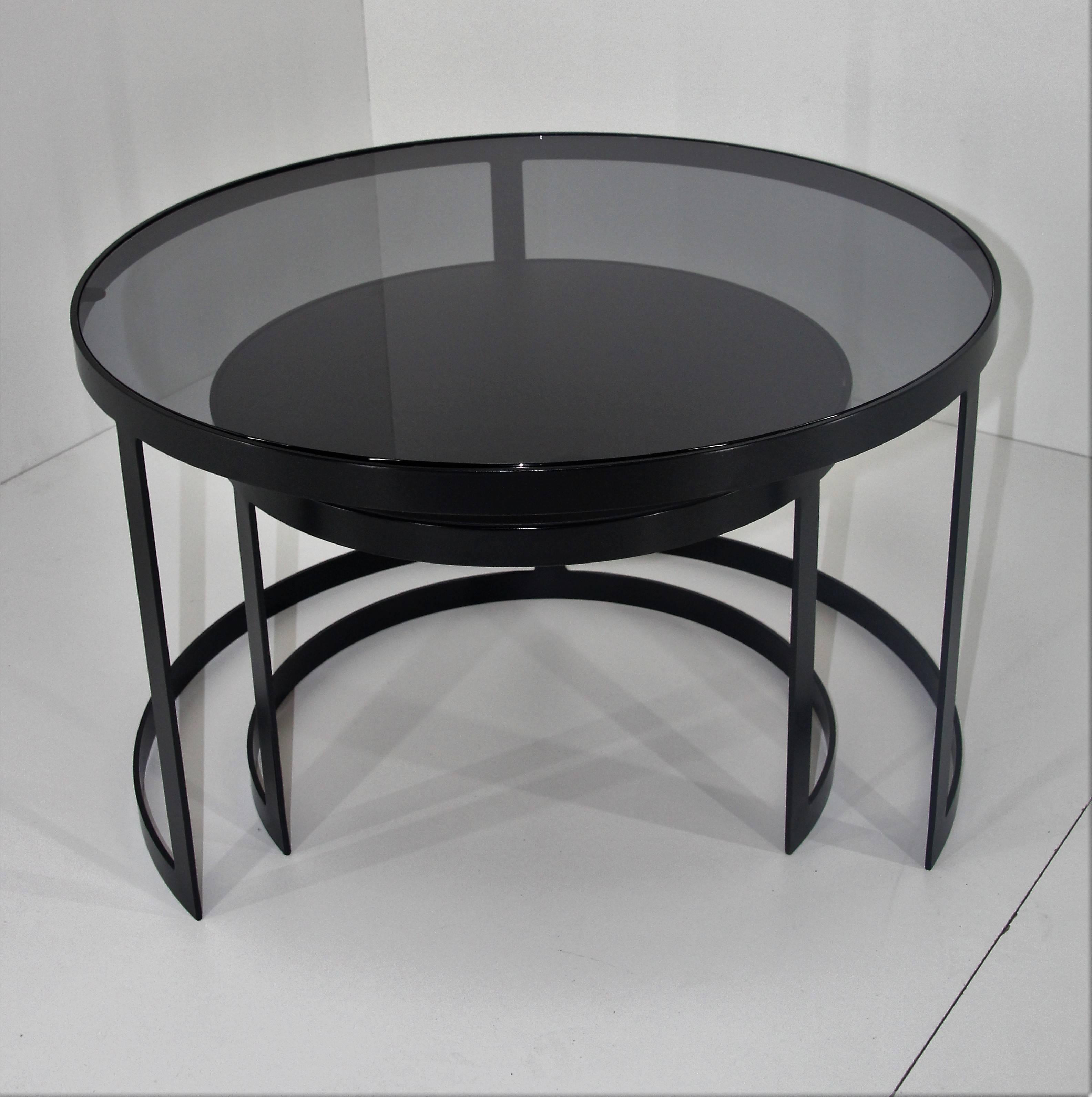 21st century set of two iron nesting tables with glass and wood tops, Spain

Frame material: Extruded and hand-welded iron rods
Frame finish: Black
Iron rods dimensions: 1.96 inches x 0.1 inches
Top: 0.4 inches wood / 0.4 inches glass

Table