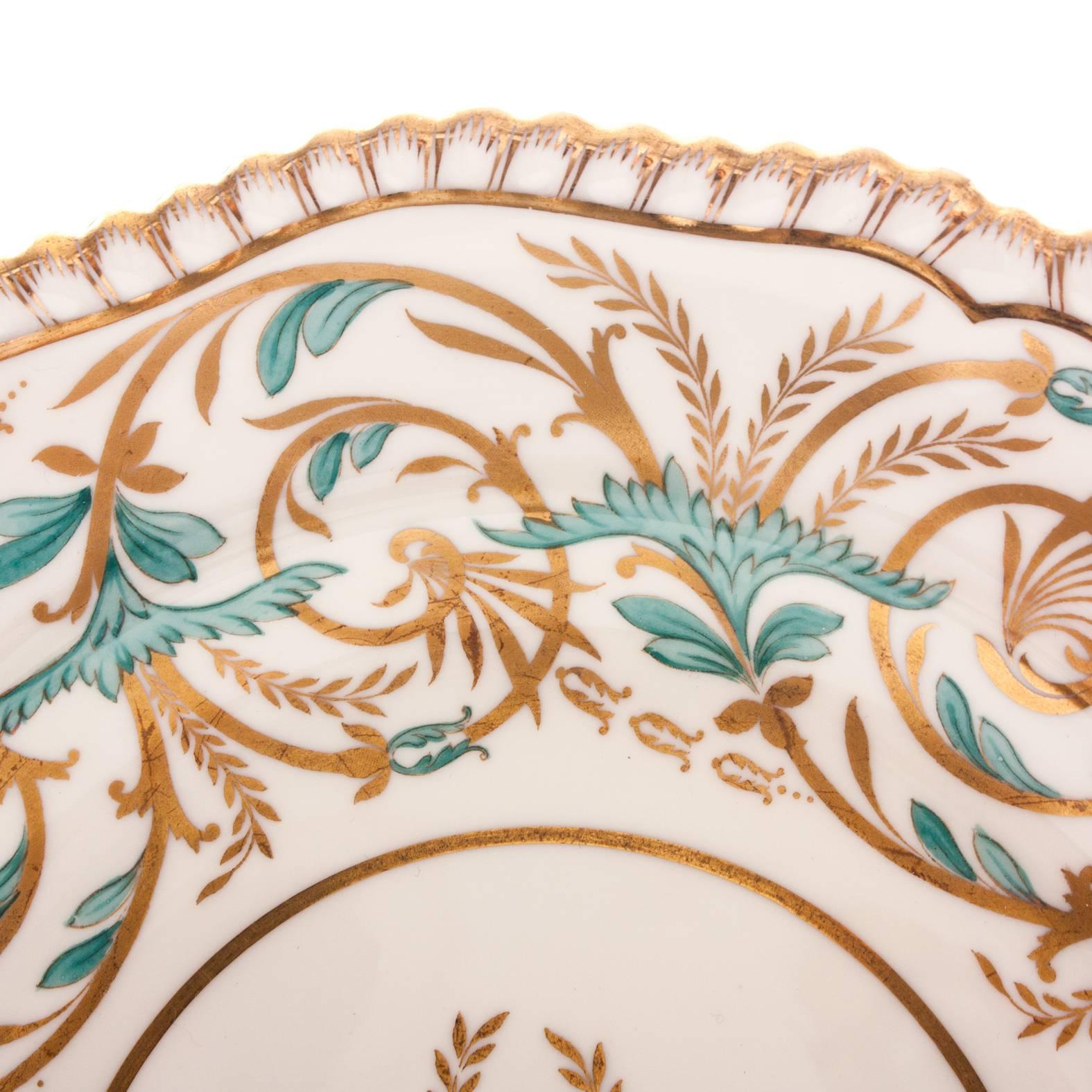 One of Spode's classic Antique Patterns highlighted in a vibrant turquoise color. Produced in 1920's from their archive collection. Featuring a beautiful gadroon edge, center medallion and allover gilt design. Perfect for mixing and matching in with