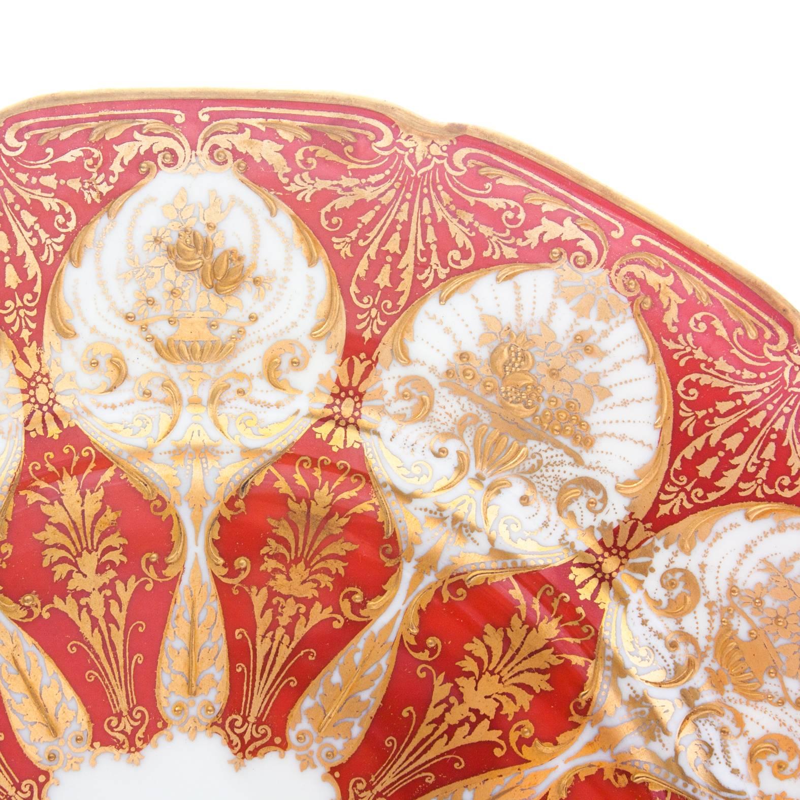 A vibrant and unique set of 12 plates by Royal Doulton, England. Raised and designed with a lavishly heavy hand tooled gilding technique on a hard to find orange ground. A Classic Robert Allen shape and in lovely antique condition. Hallmarked by the