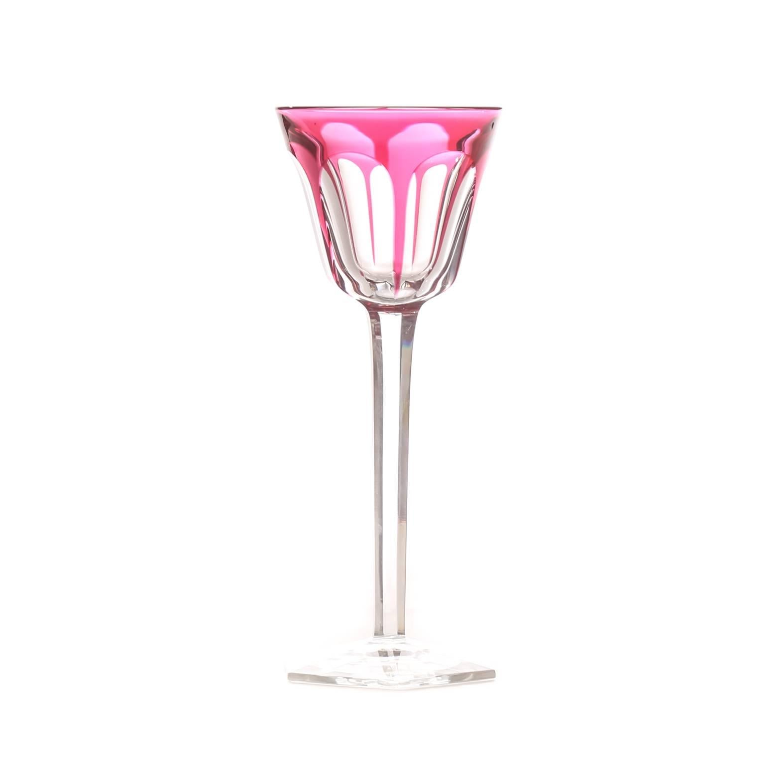 We have available a perfect size wine glass by Baccarat cut to clear in their signature ruby color. An elongated thumbprint design on the bowl and a nicely shaped foot. Signed. Measuring 7.5