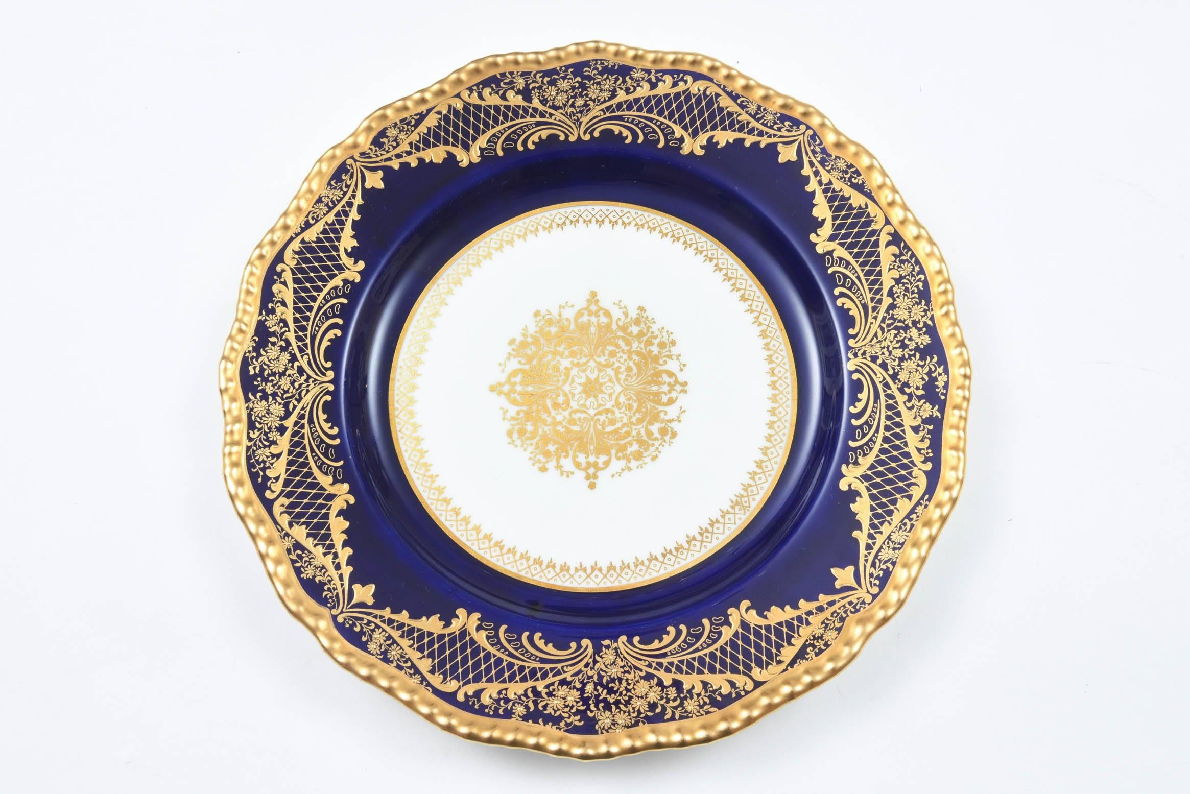 We love the shaped gadroon edge on these handsome antique Royal Doulton Plates. A great center gilt medallion and nice raised tooled gold on their cobalt shoulders. Custom Fifth Ave New York Retailer who was re known for tabletop in the early part